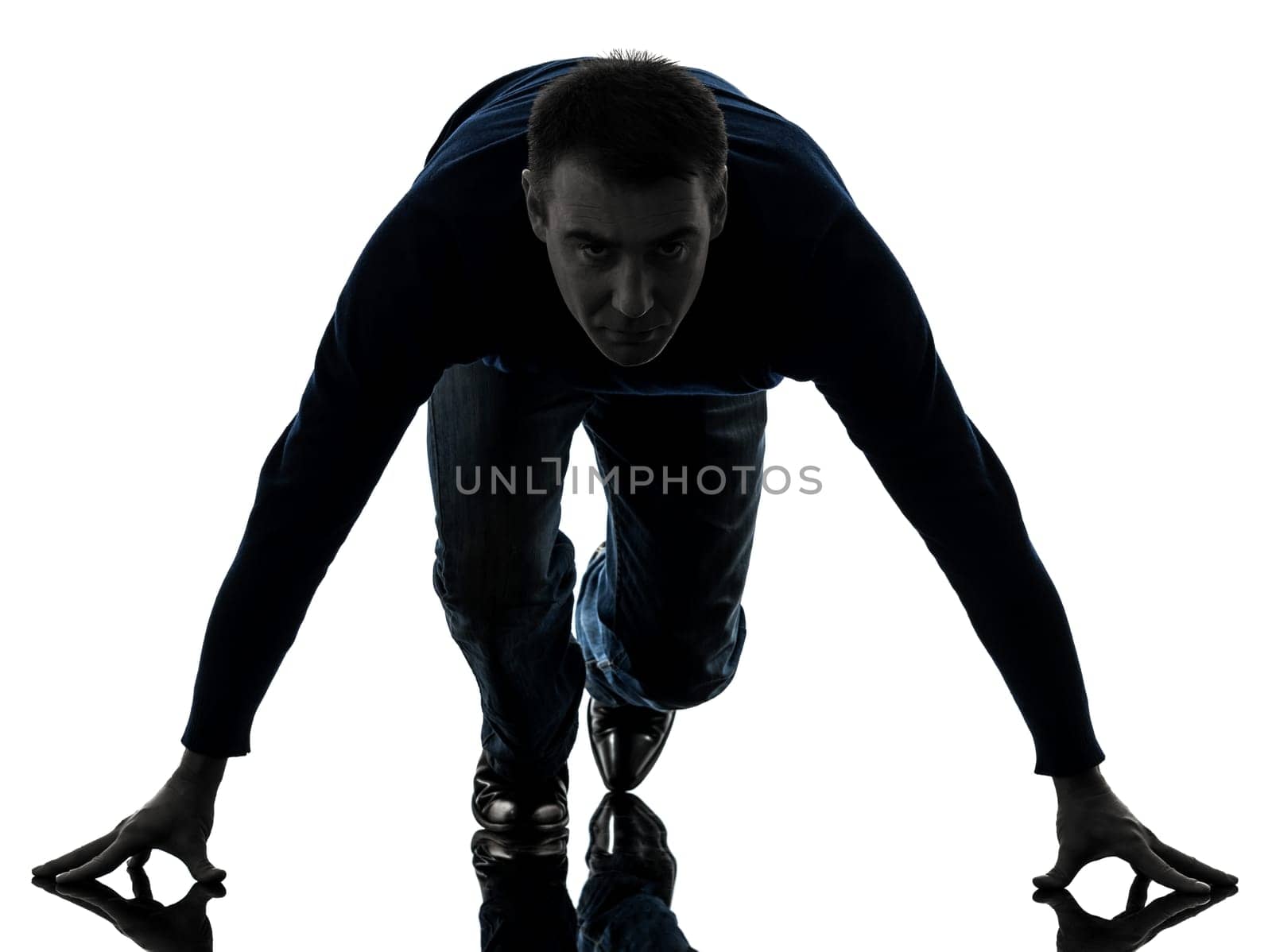one caucasian man starting blocks full length in silhouette studio isolated on white background