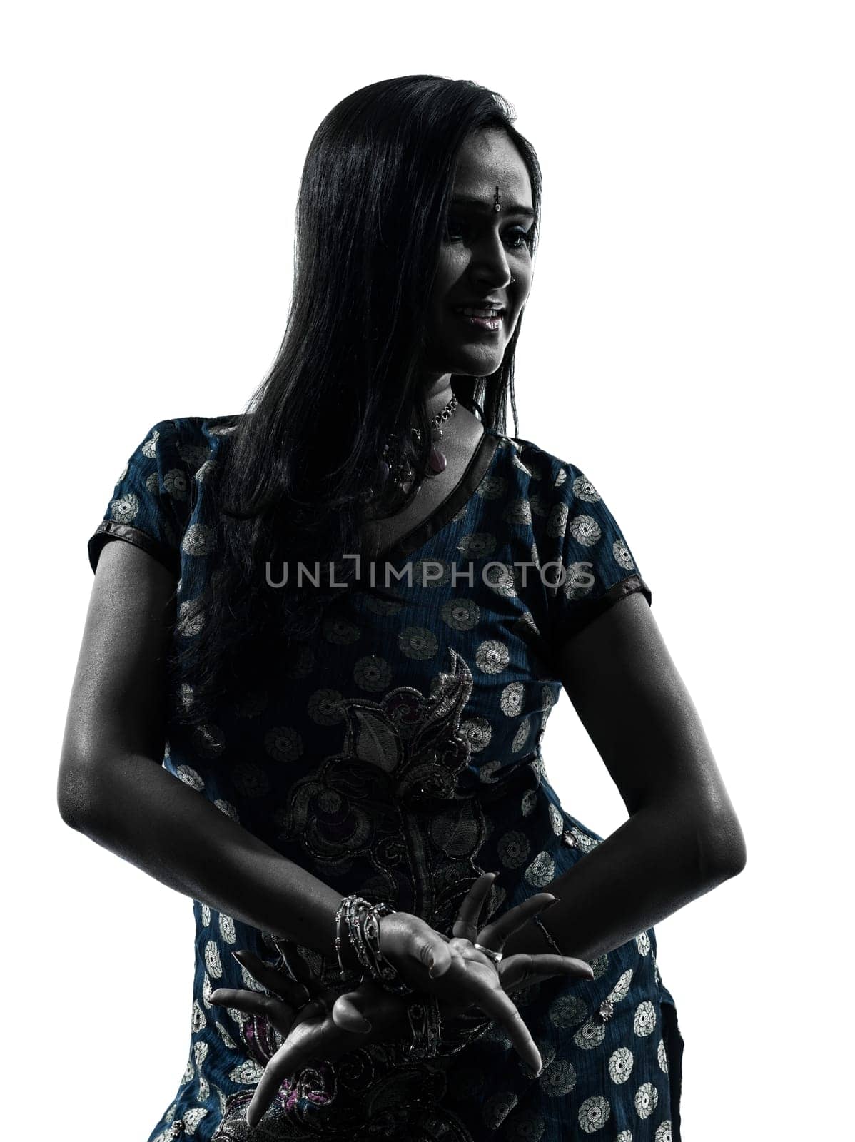 one indian woman in silhouette studio isolated on white background