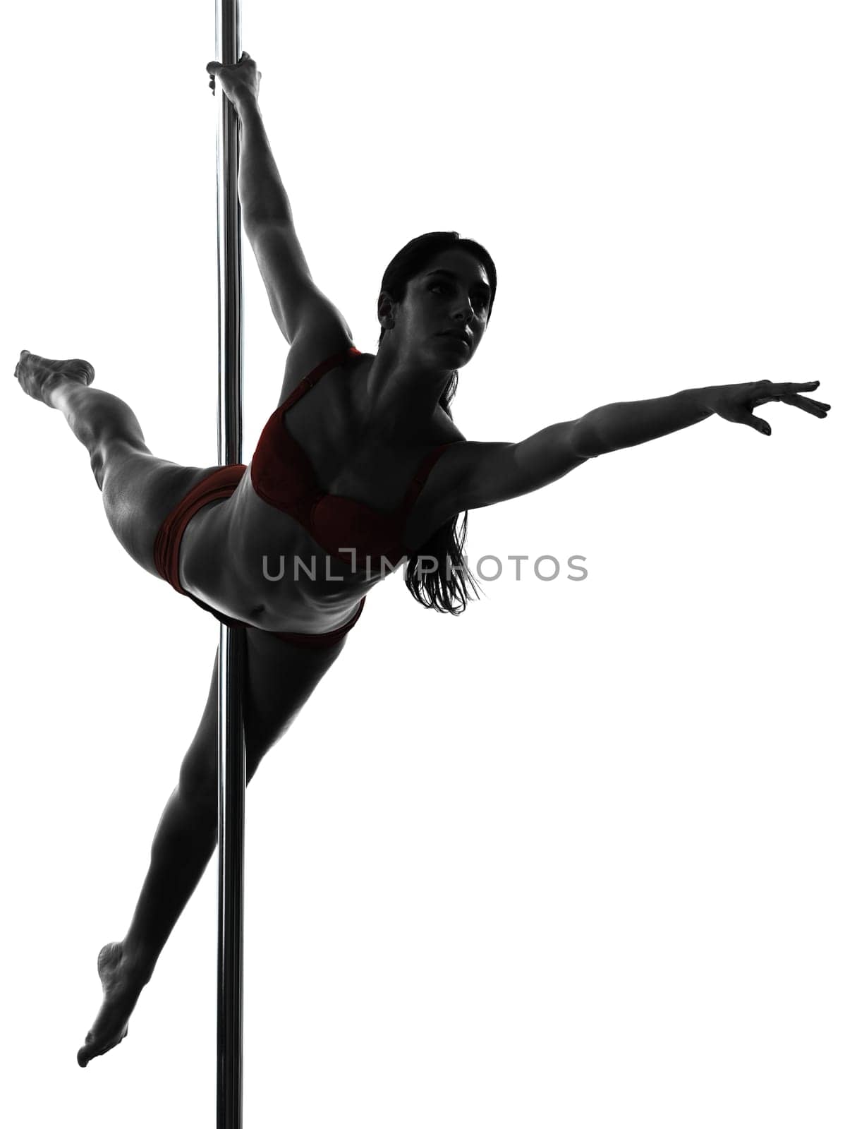 one caucasian woman pole dancer dancing in silhouette studio isolated on white background