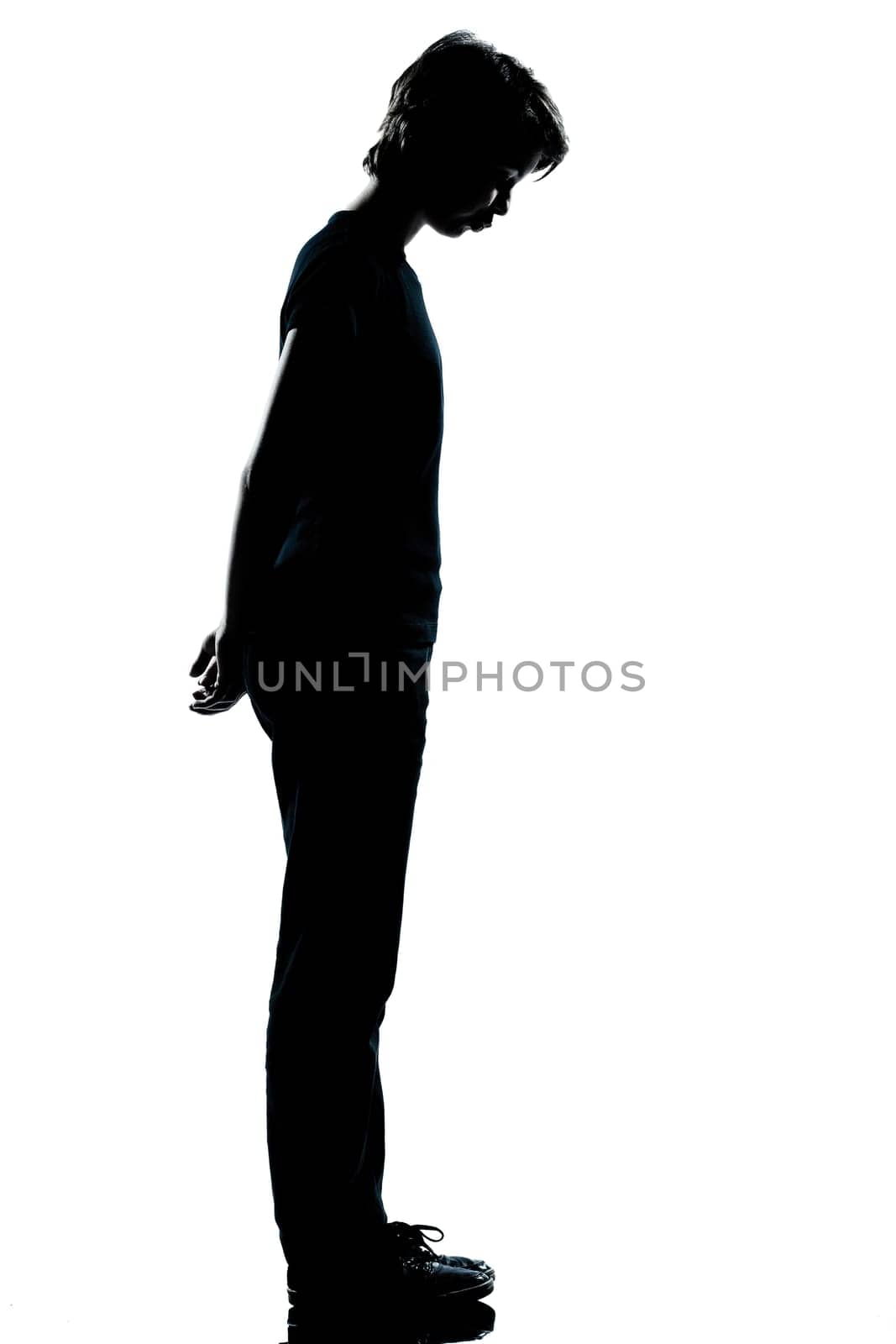 one caucasian young teenager silhouette boy or girl full length in studio cut out isolated on white background