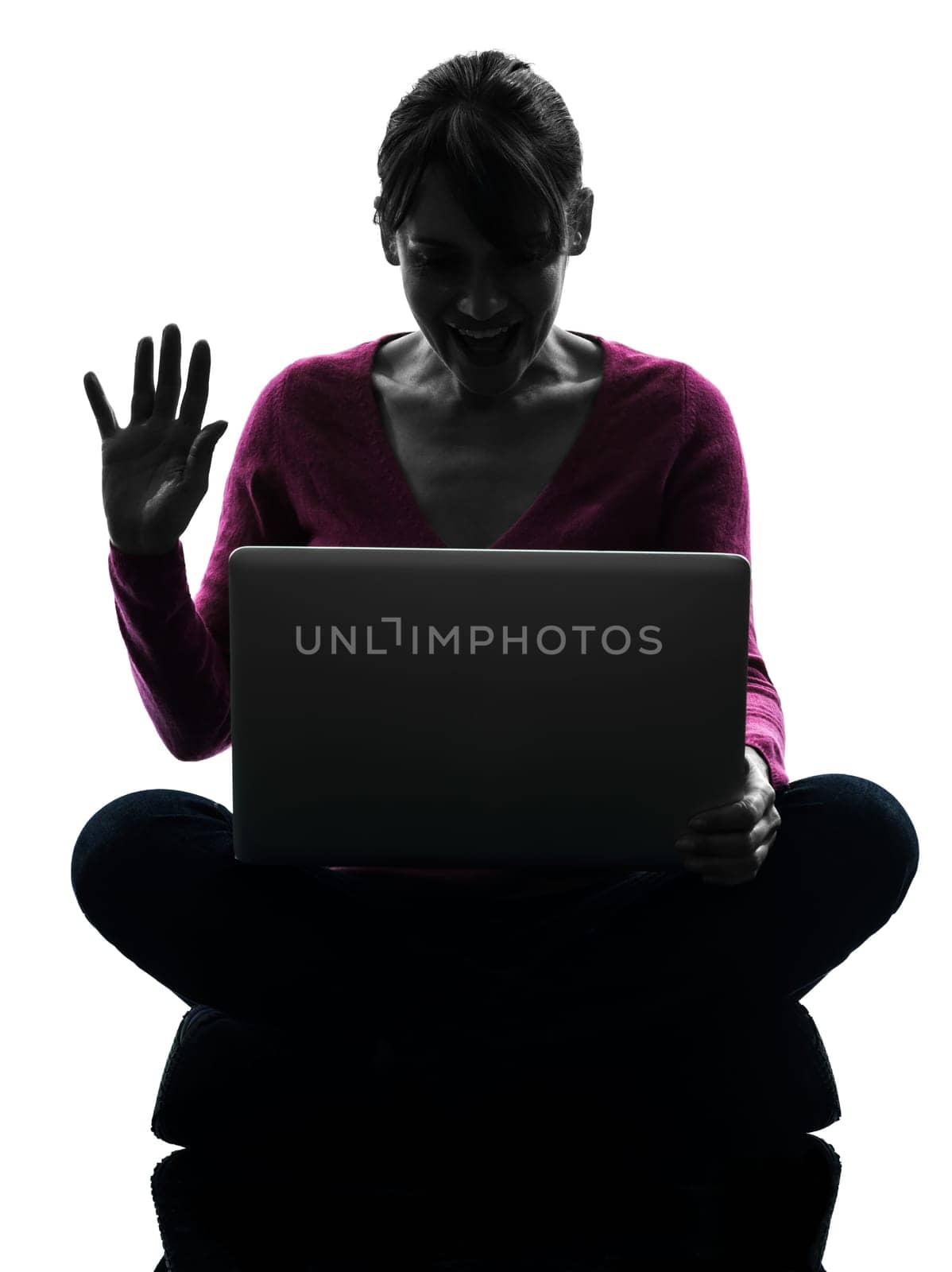 one caucasian woman saluting computing laptop computer  in silhouette studio isolated on white background