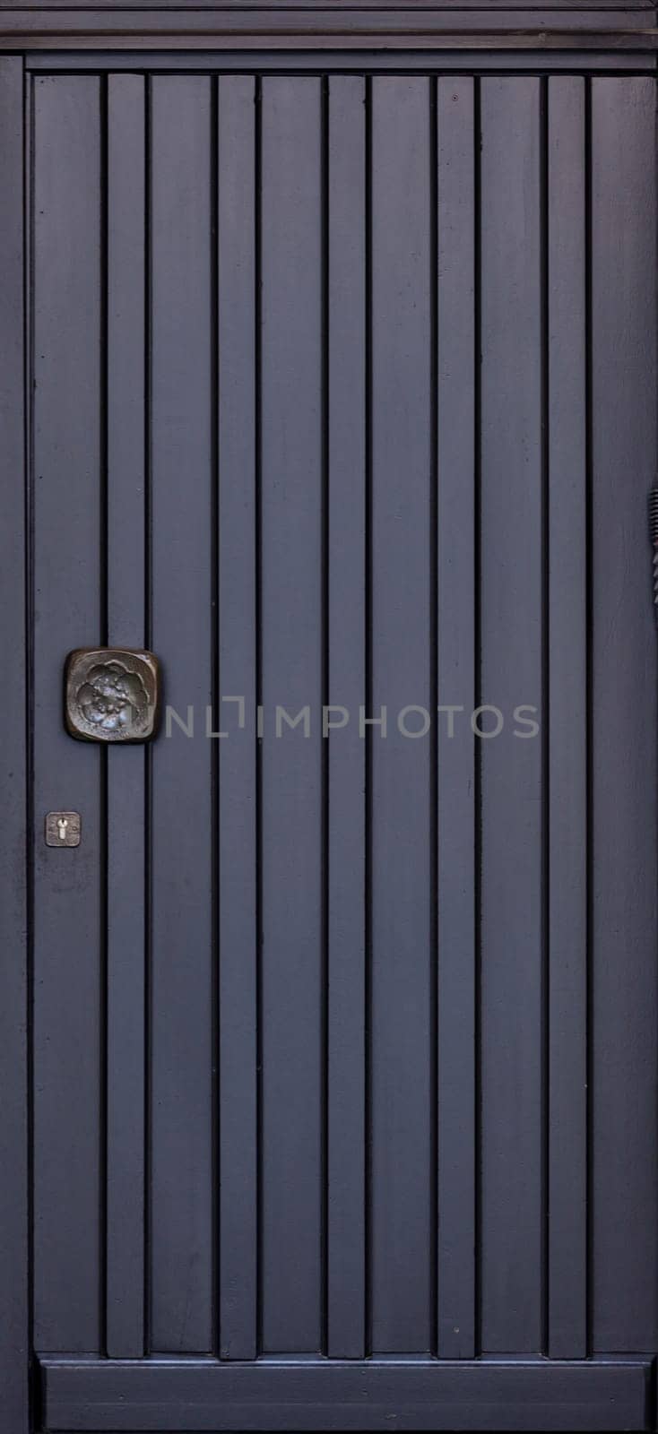 Wooden front door of a home. Old Wooden Door.