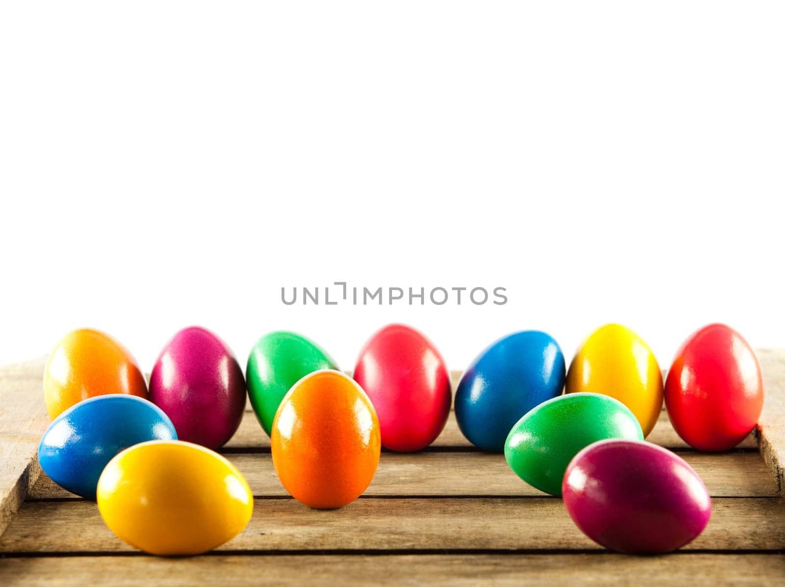 Colorful easter eggs on old wooden background. Easter concept. The colorful painted Easter eggs