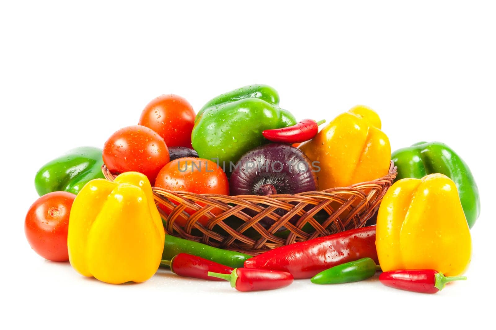 Fresh vegetables in basket isolated on white. Bio Vegetable.  Composition with raw vegetables and basket isolated on white