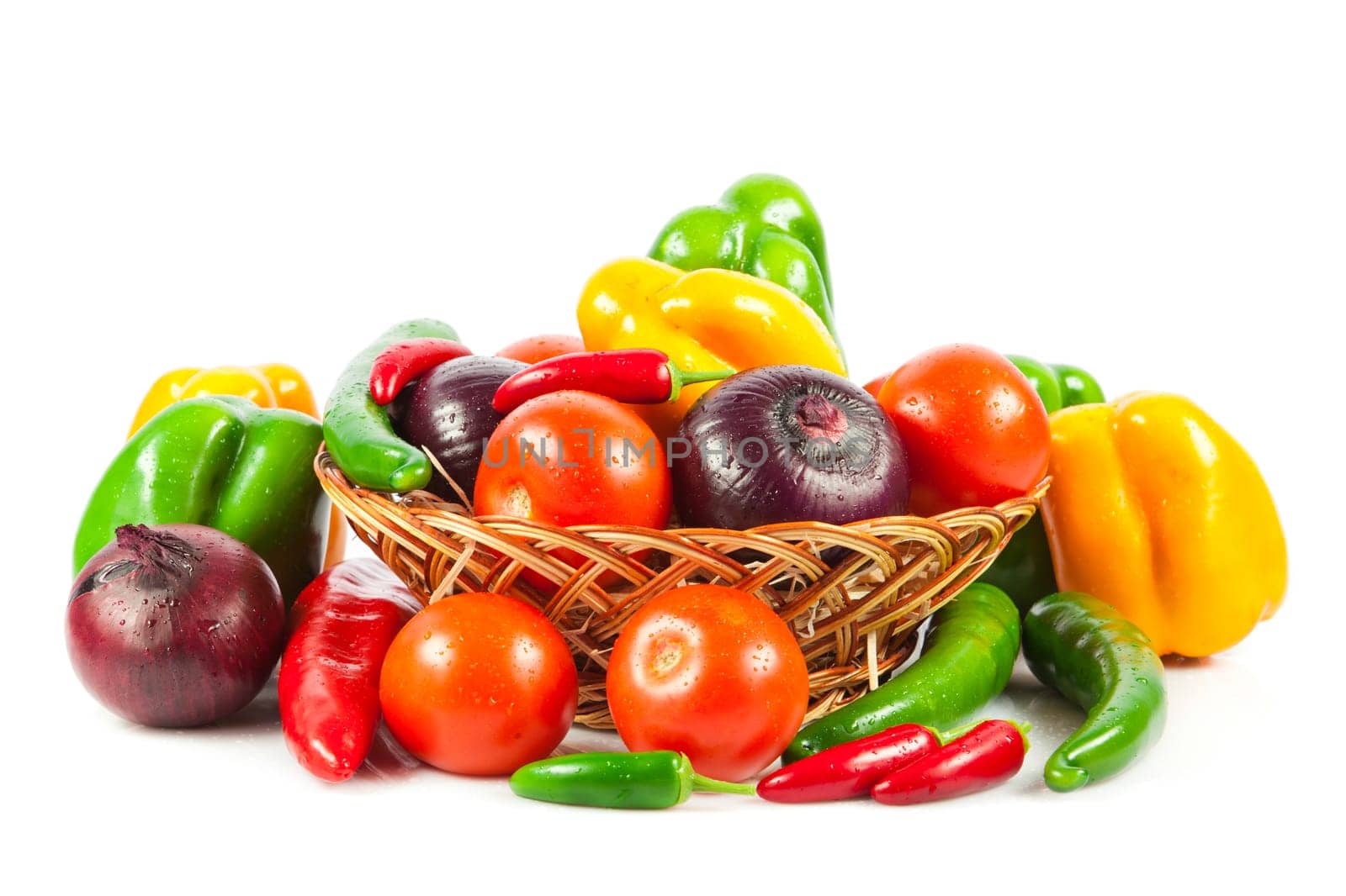 Fresh vegetables in basket isolated on white. Bio Vegetable.  Composition with raw vegetables and basket isolated on white