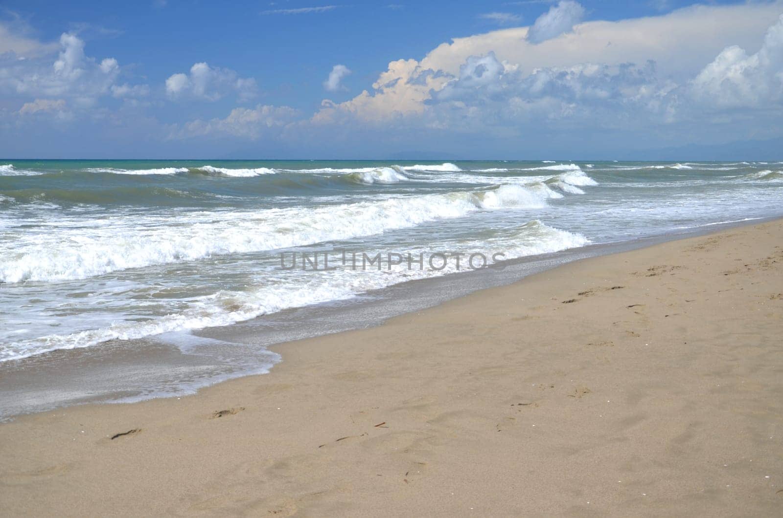 Restless sea on sandy beach Marina di Vecchiano nearby Pisa, Tuscany in Italy