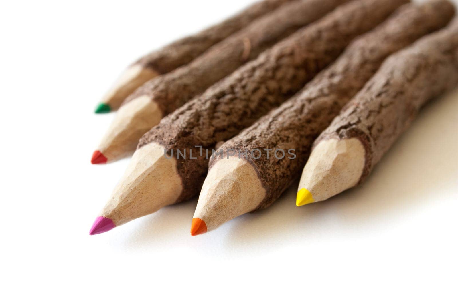 Colored pencils on white background