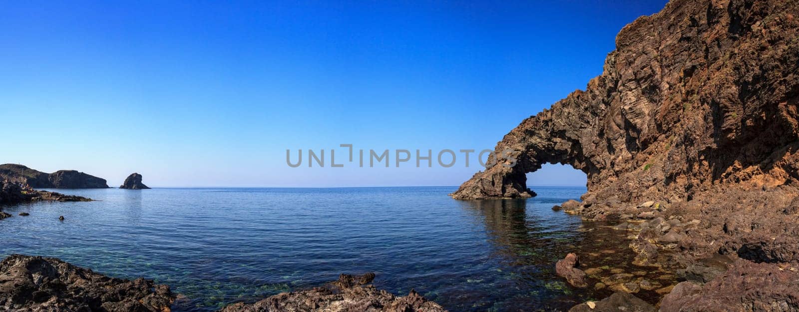 View of Arco dell'Elefante and Faraglioni in the Pantelleria island, Sicily