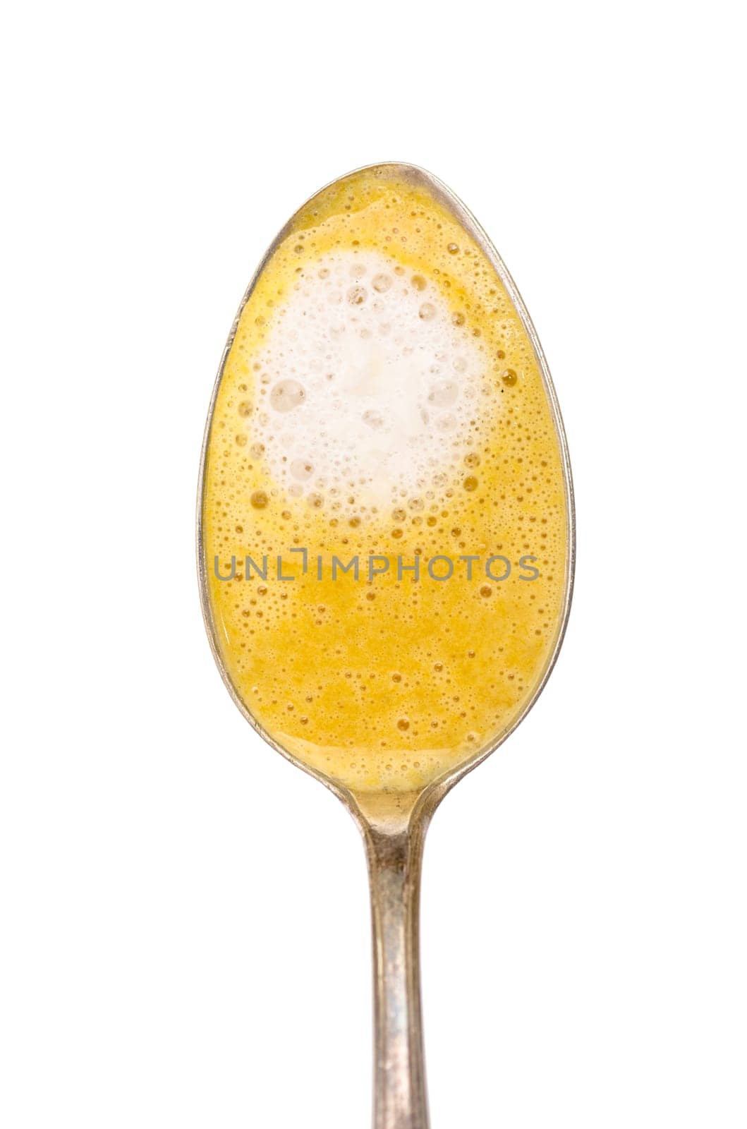 Freeguard spoon with carrot soup and coconut milk