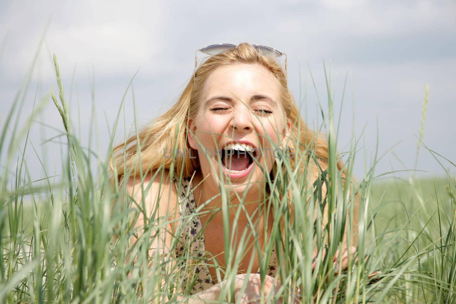 Young woman lies in the dunes