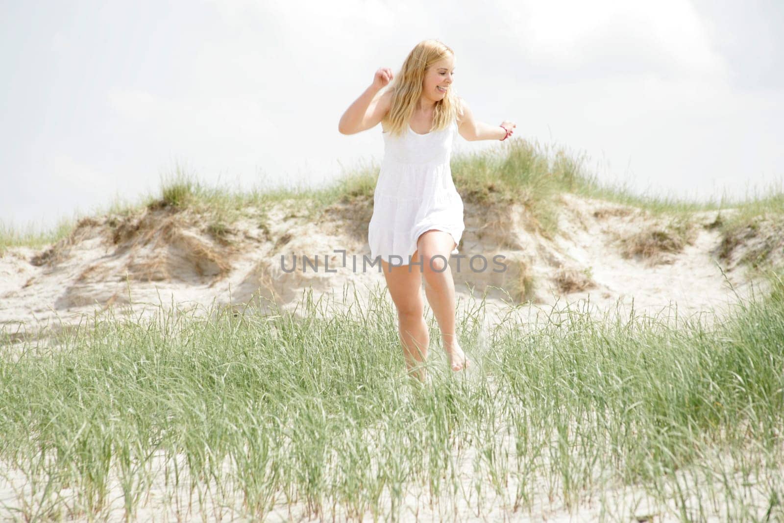 Young woman in the dunes
