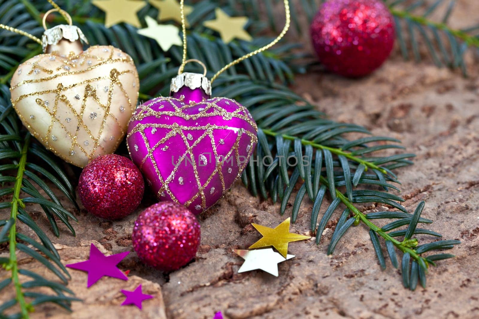 Decoration in purple and gold for Christmas on fir branches