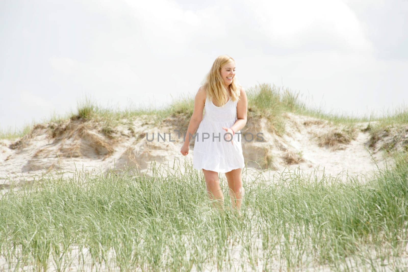 Young woman in the dunes