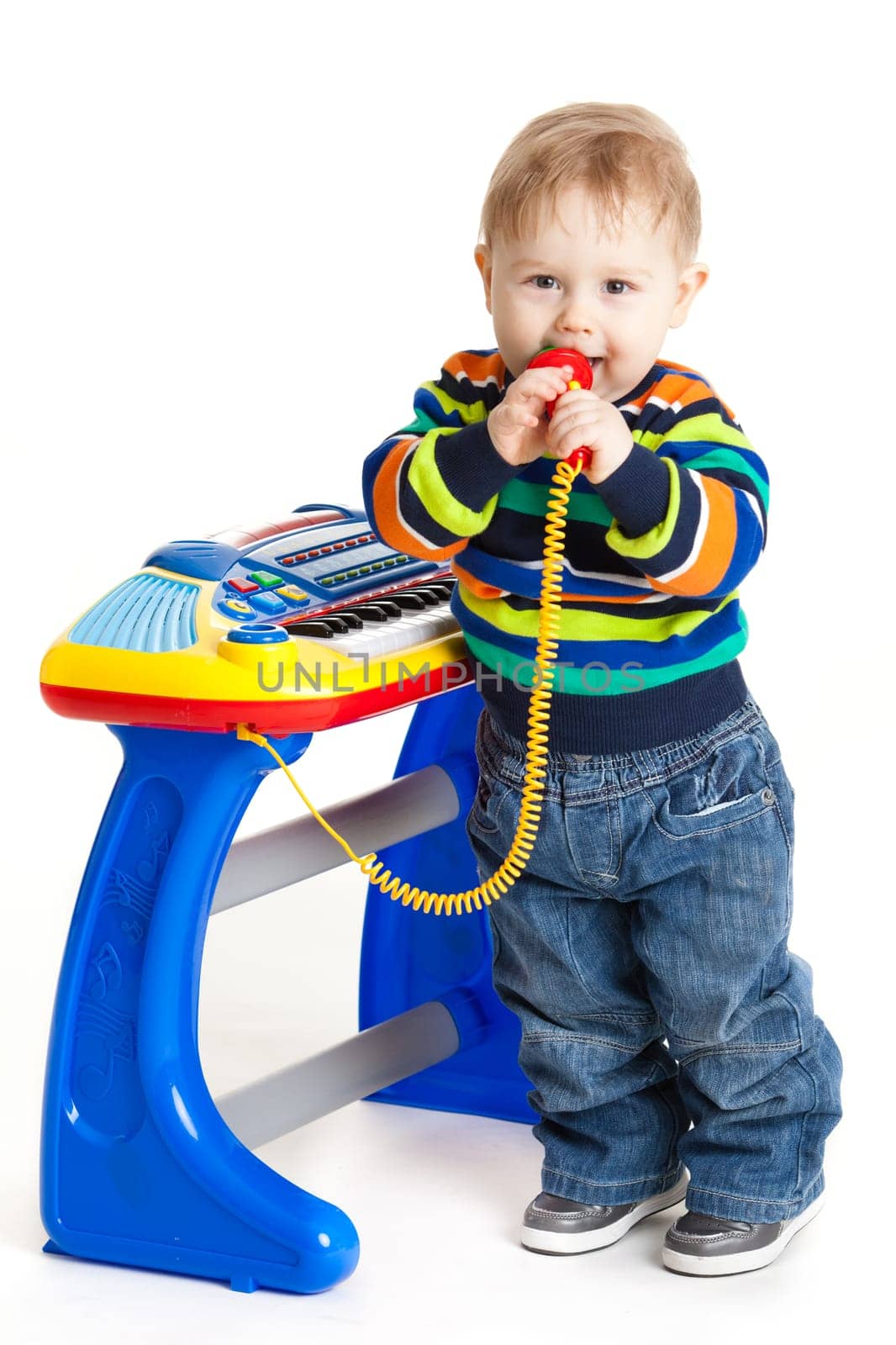 little boy and the keyboard on white background. funny boy baby. young DJ