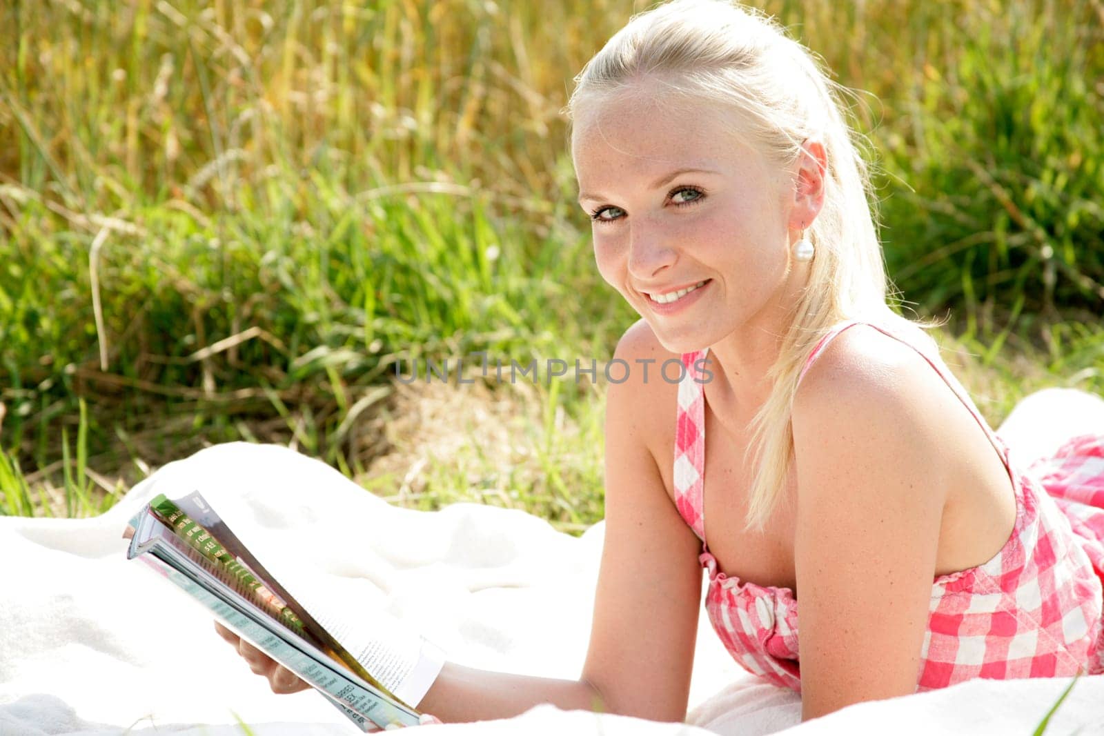 Young woman reads newspaper