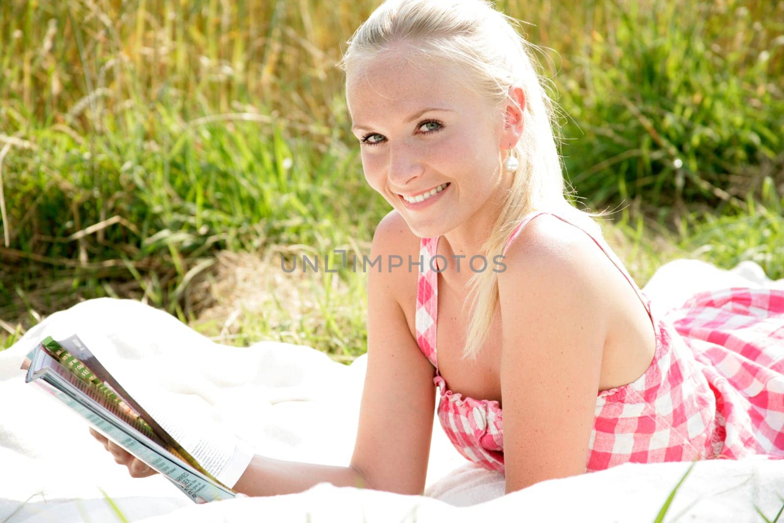 Young woman reads newspaper
