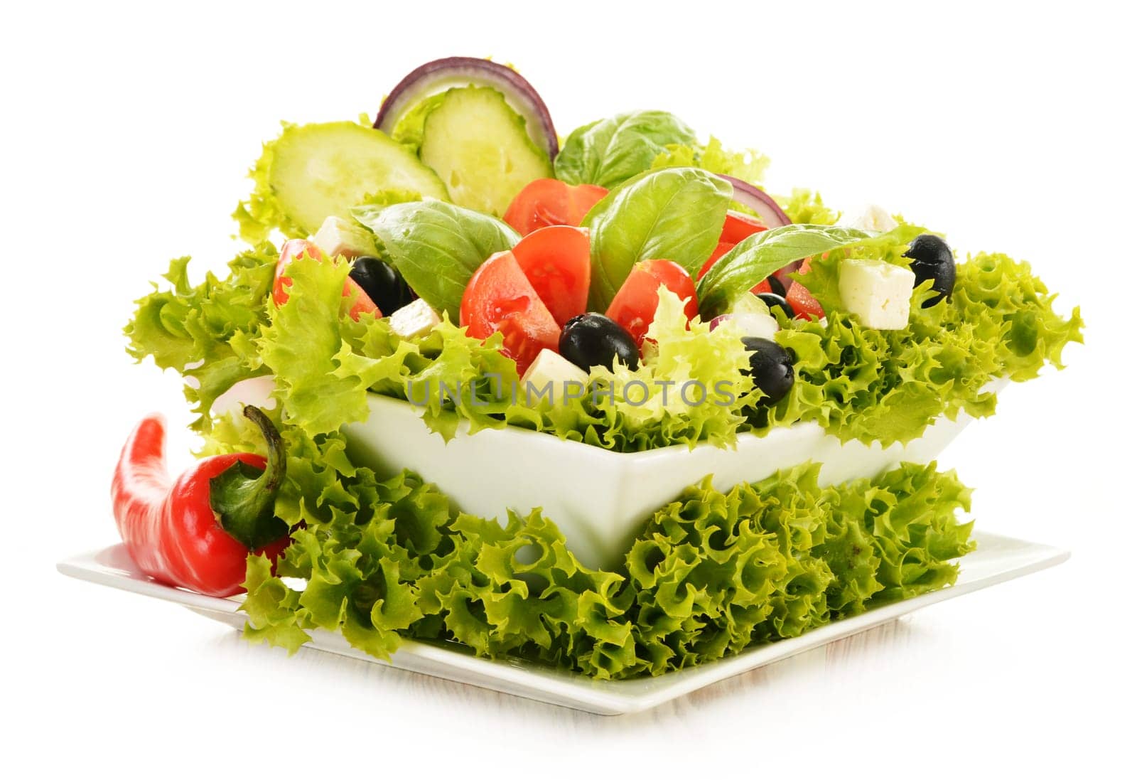 Vegetable salad bowl isolated on white