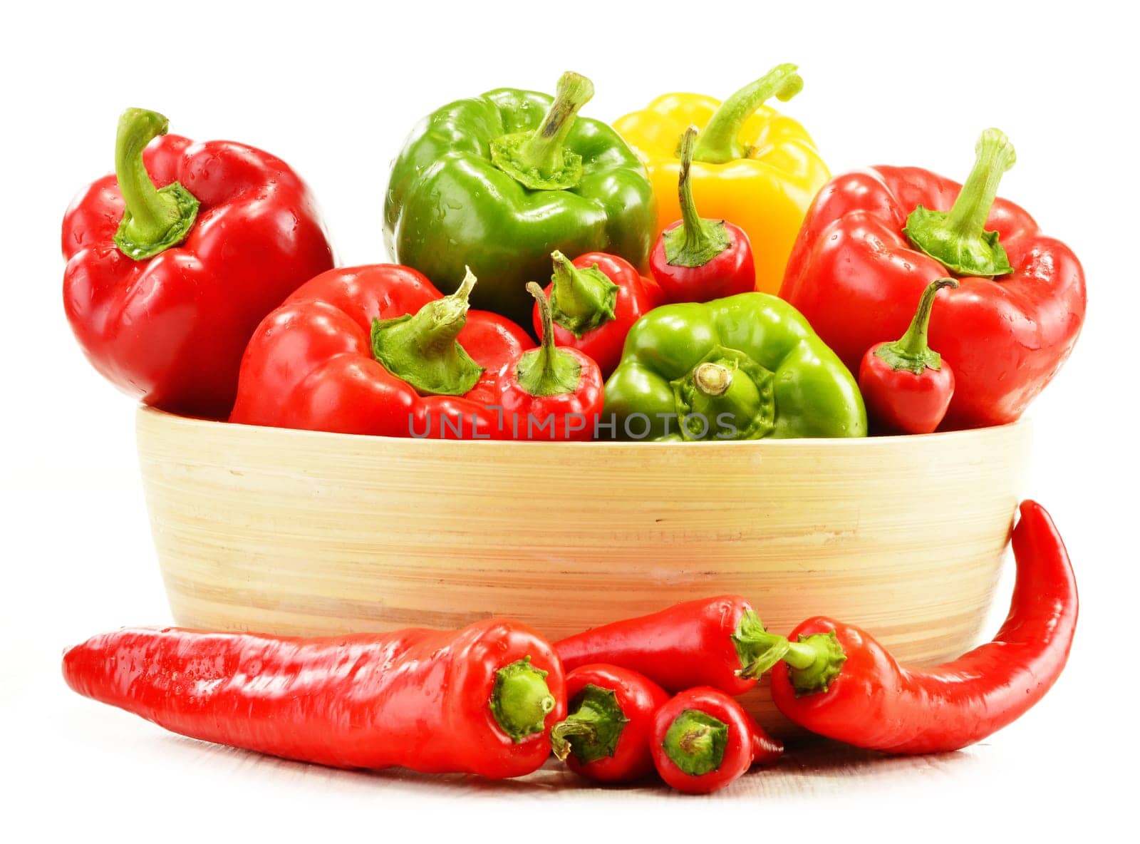 Composition with assorted peppers isolated on white background