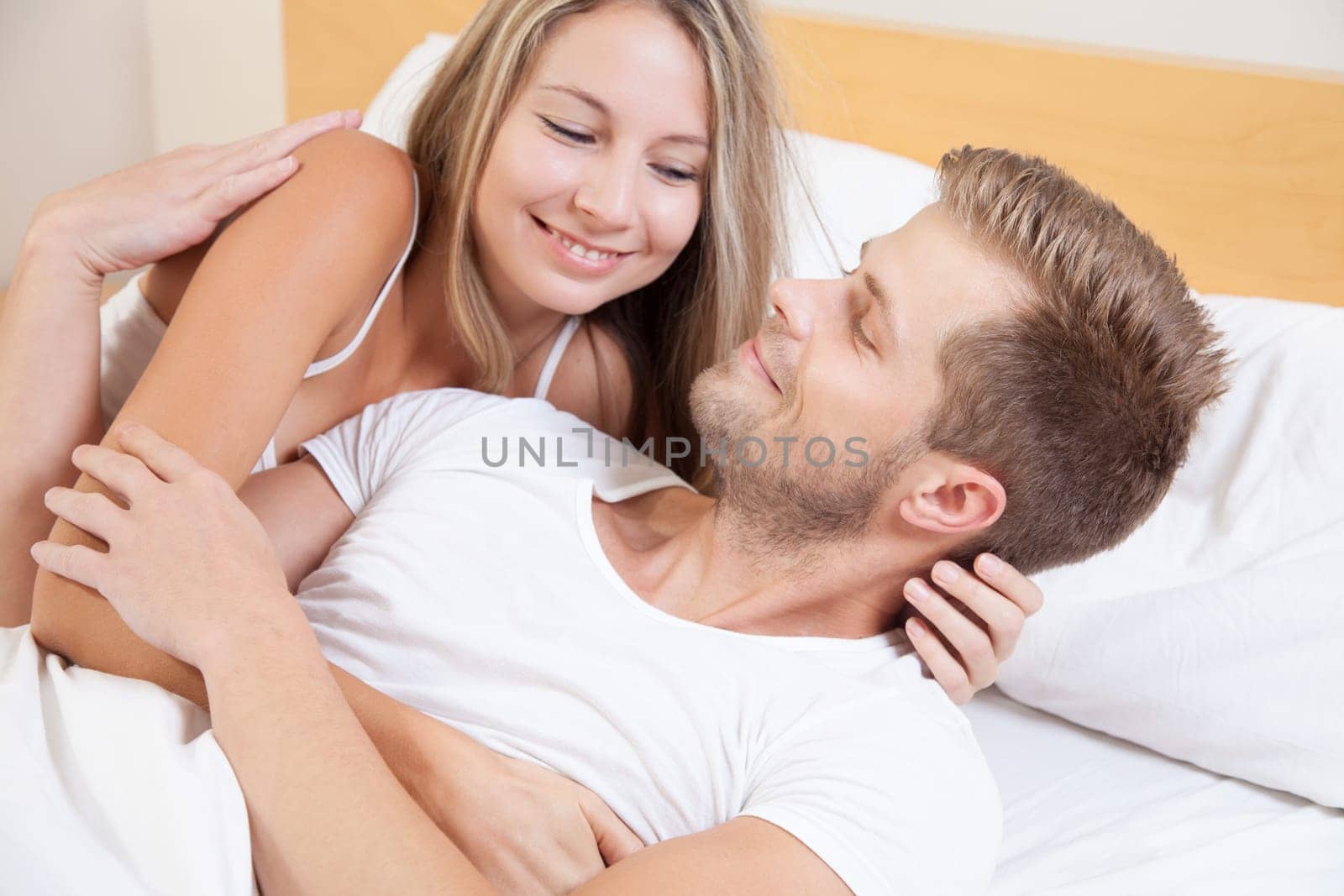 Happy couple in bed