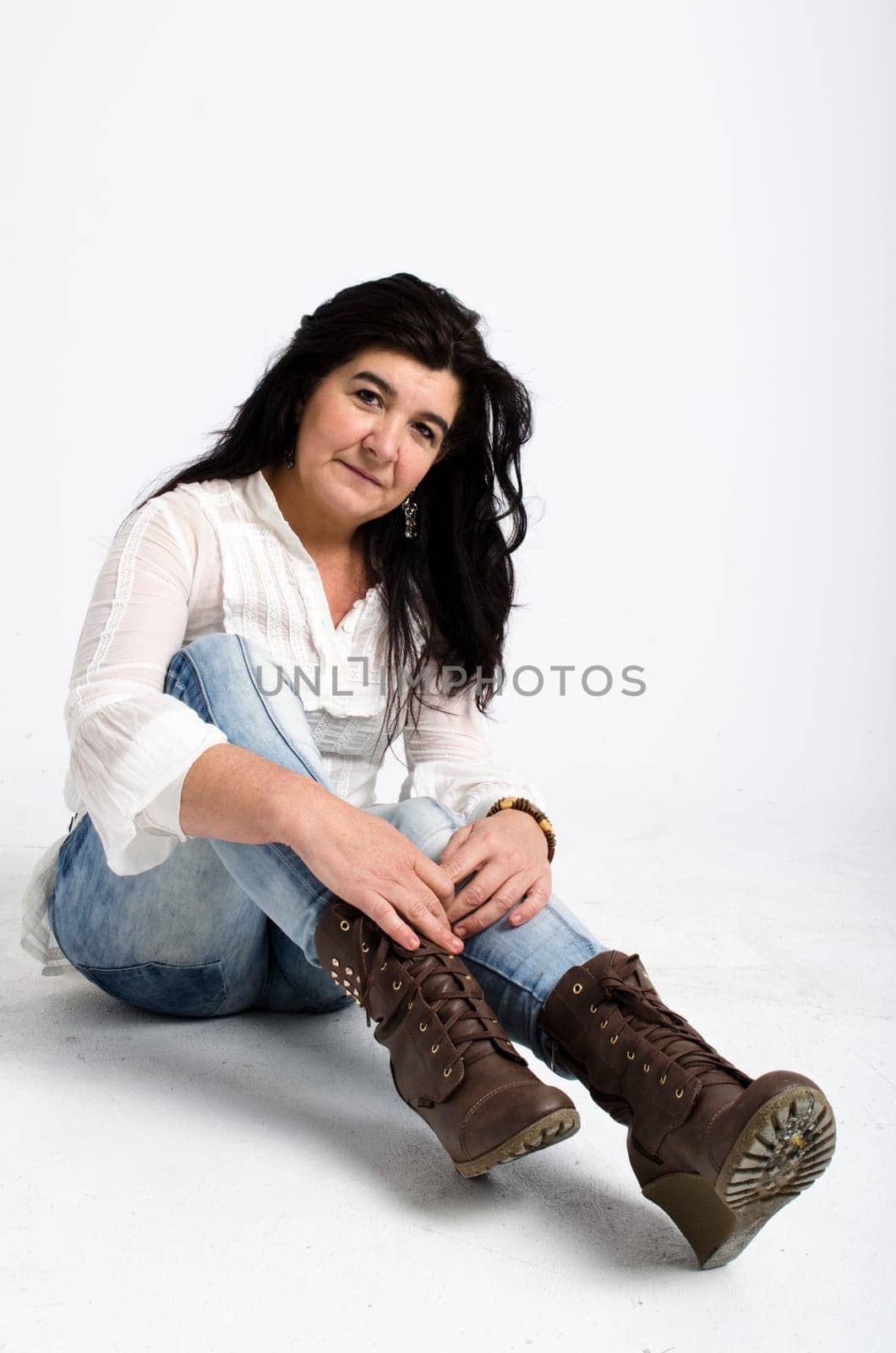 senior woman smiling over a white background