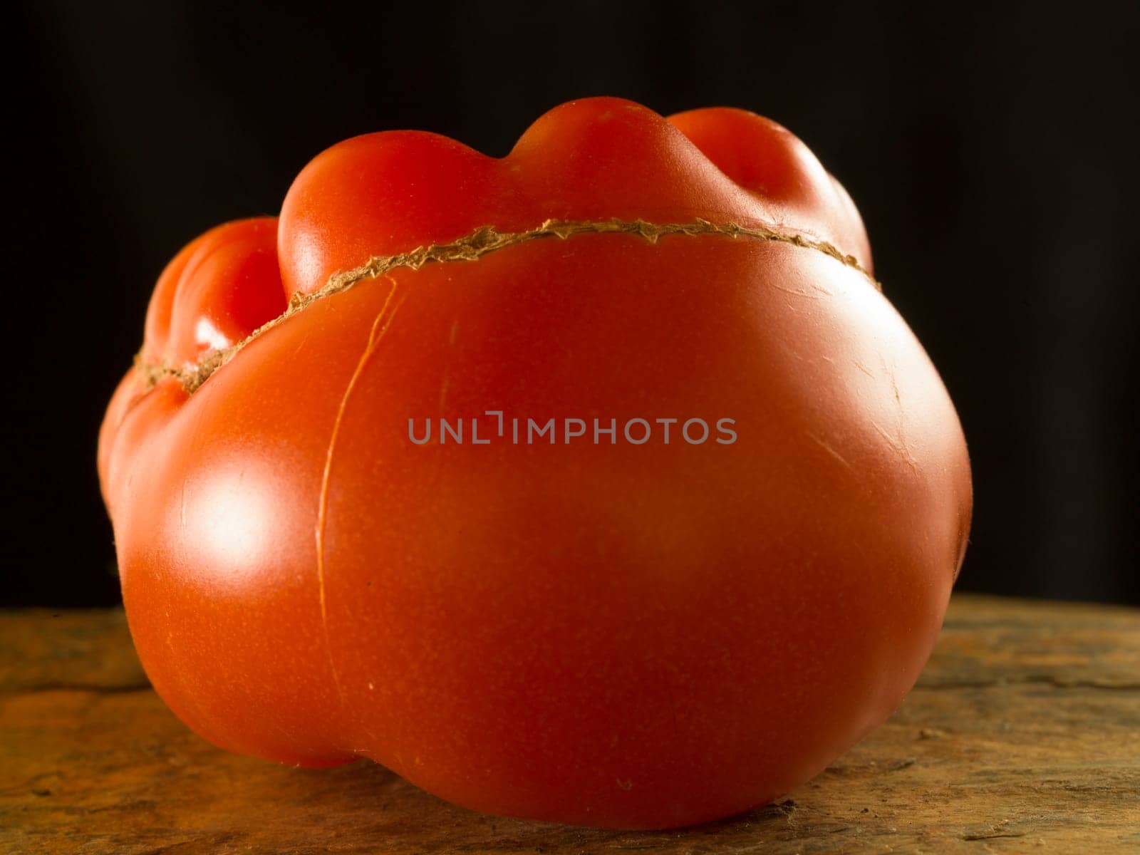 a strange tomato in an artistic way