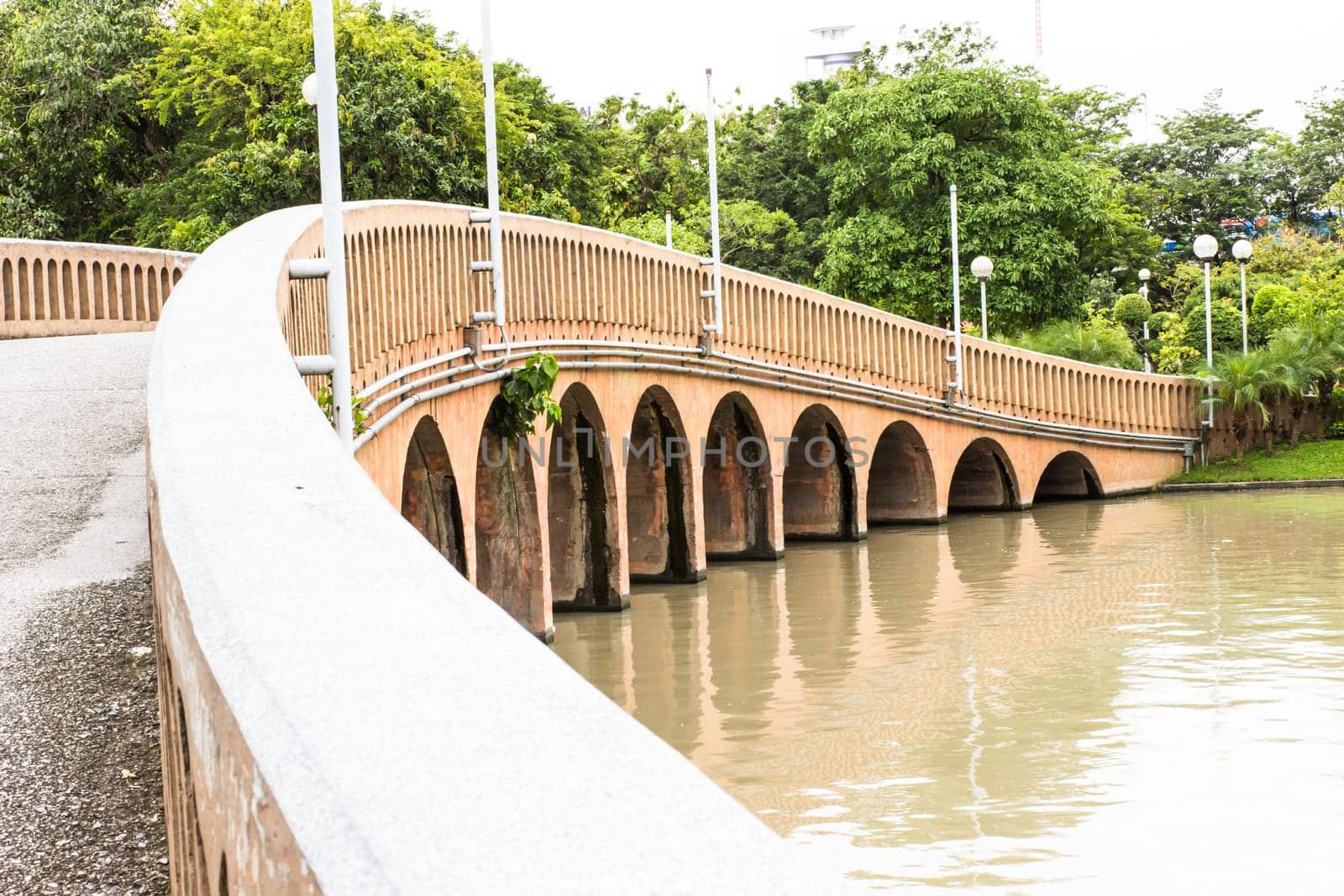 Wall of bridge across the canal at garden