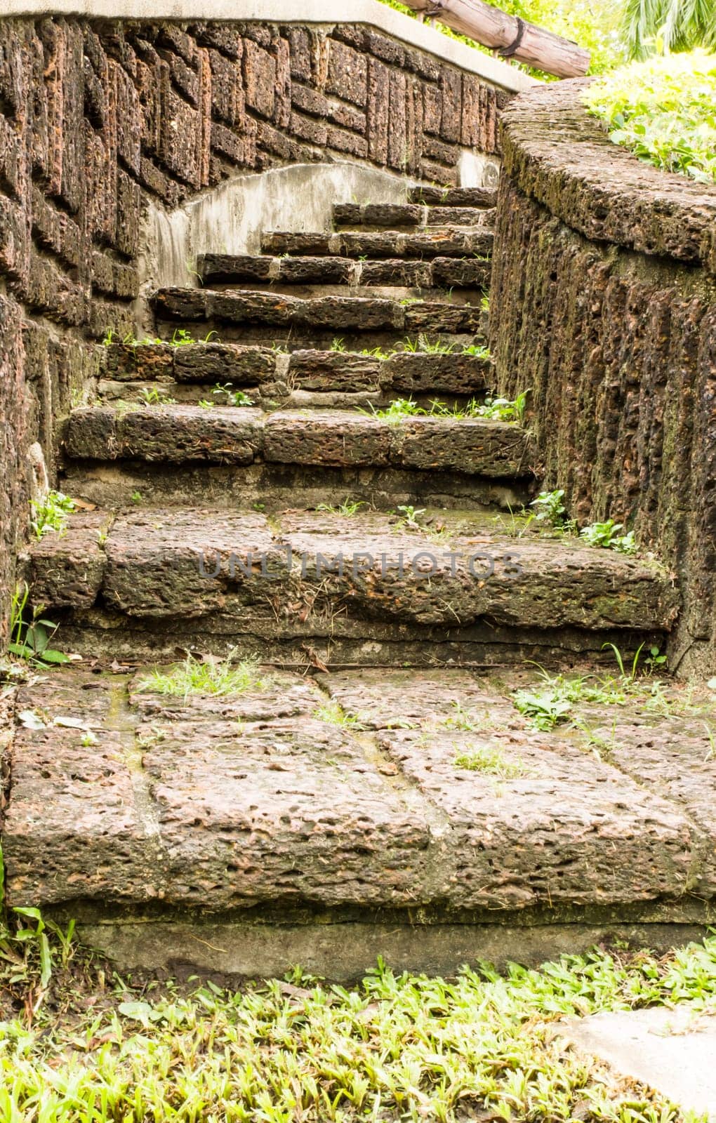 Brown stairway from stone  in garden.