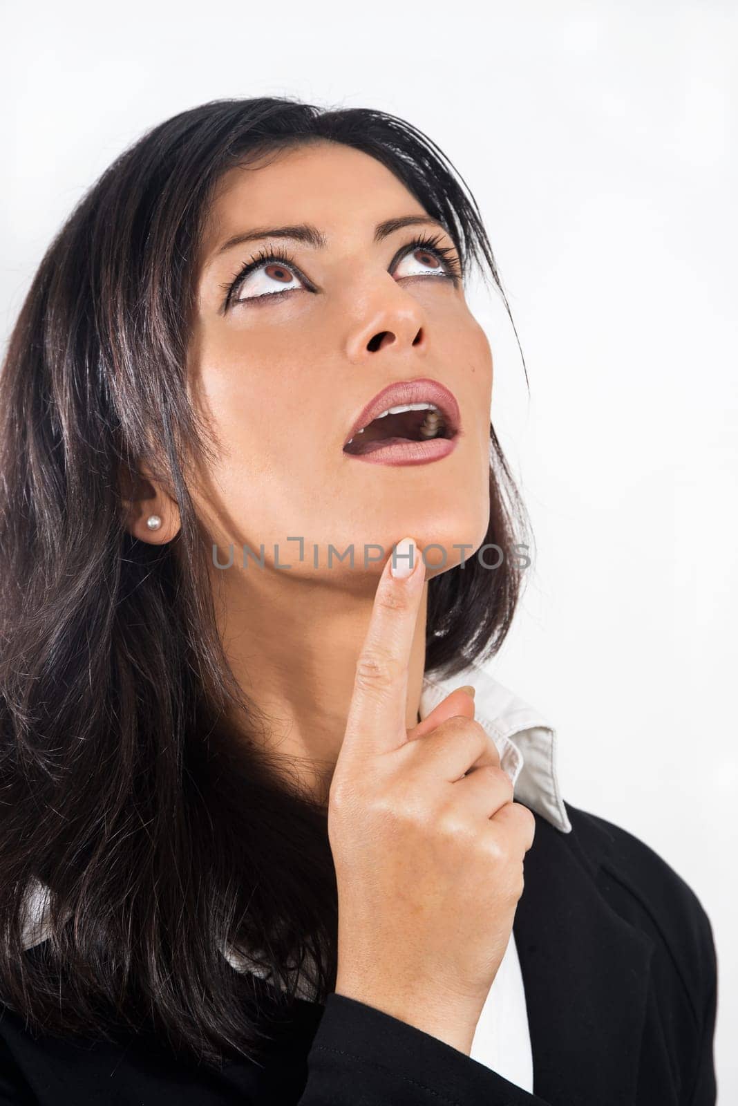 business woman in black dress with an expression of amazement as he thinks