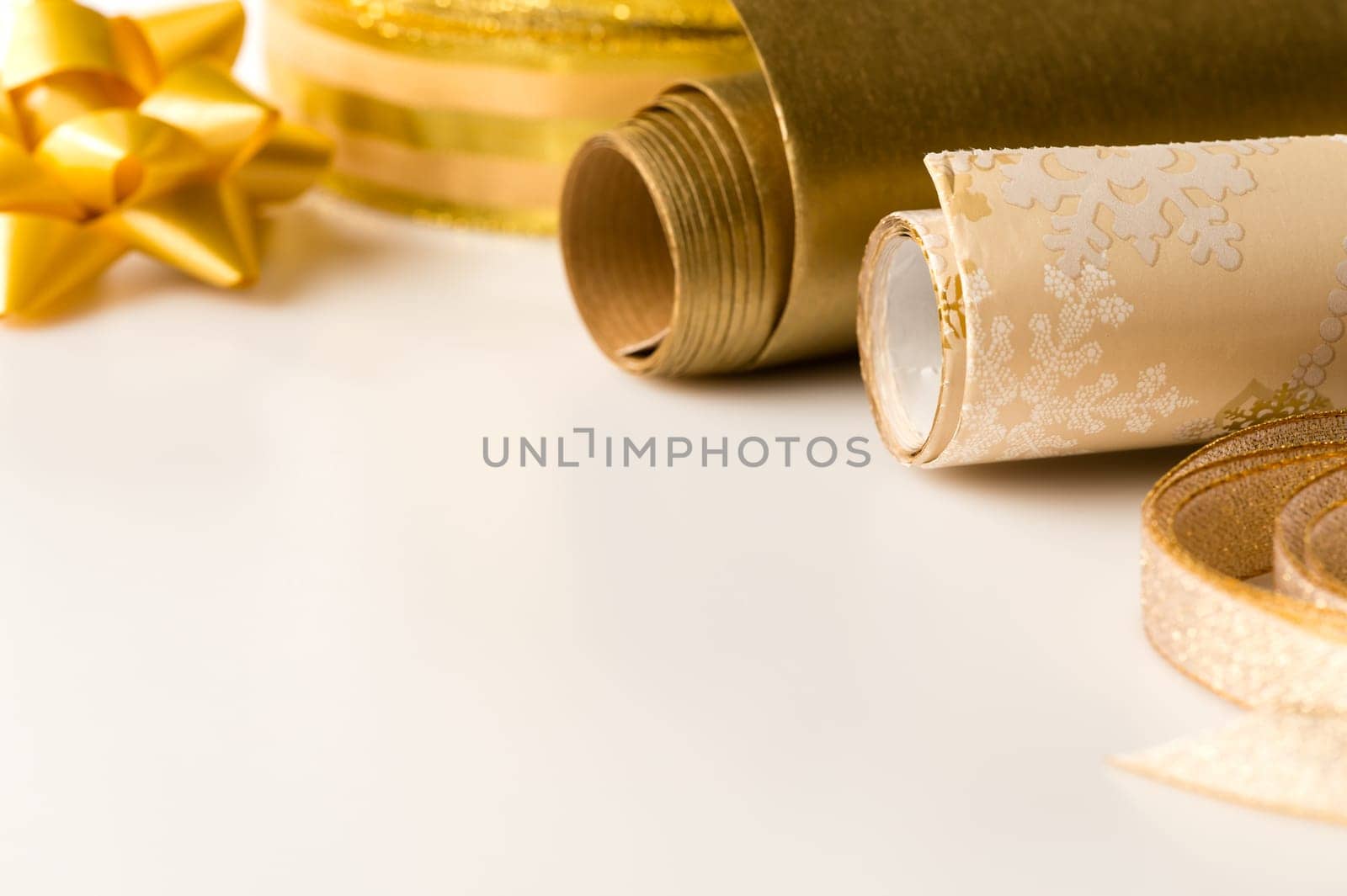 Gold wrapping paper and bow Christmas decoration present