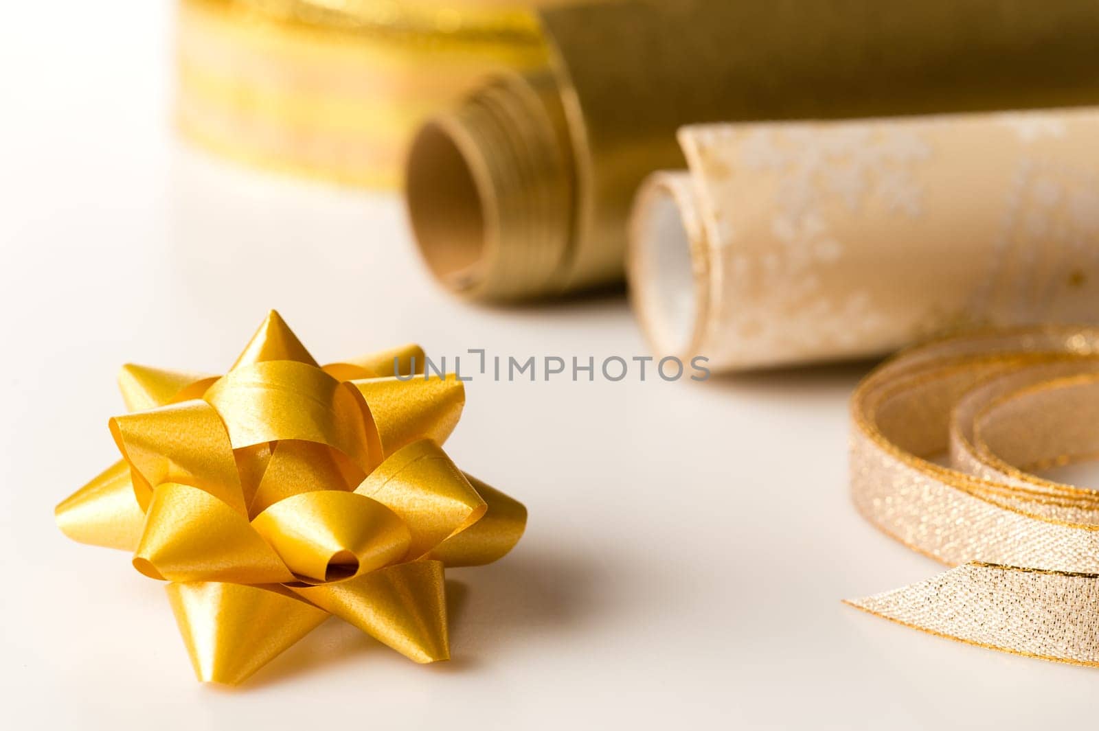 Golden wrapping paper and bow for christmas present decoration
