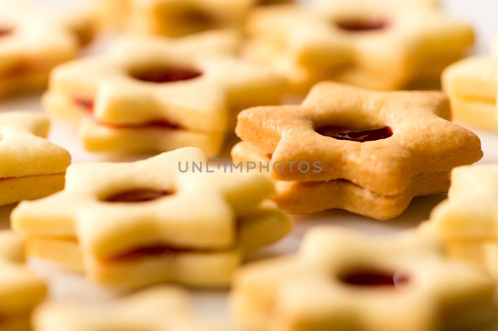 Freshly baked Christmas cookies star with jam