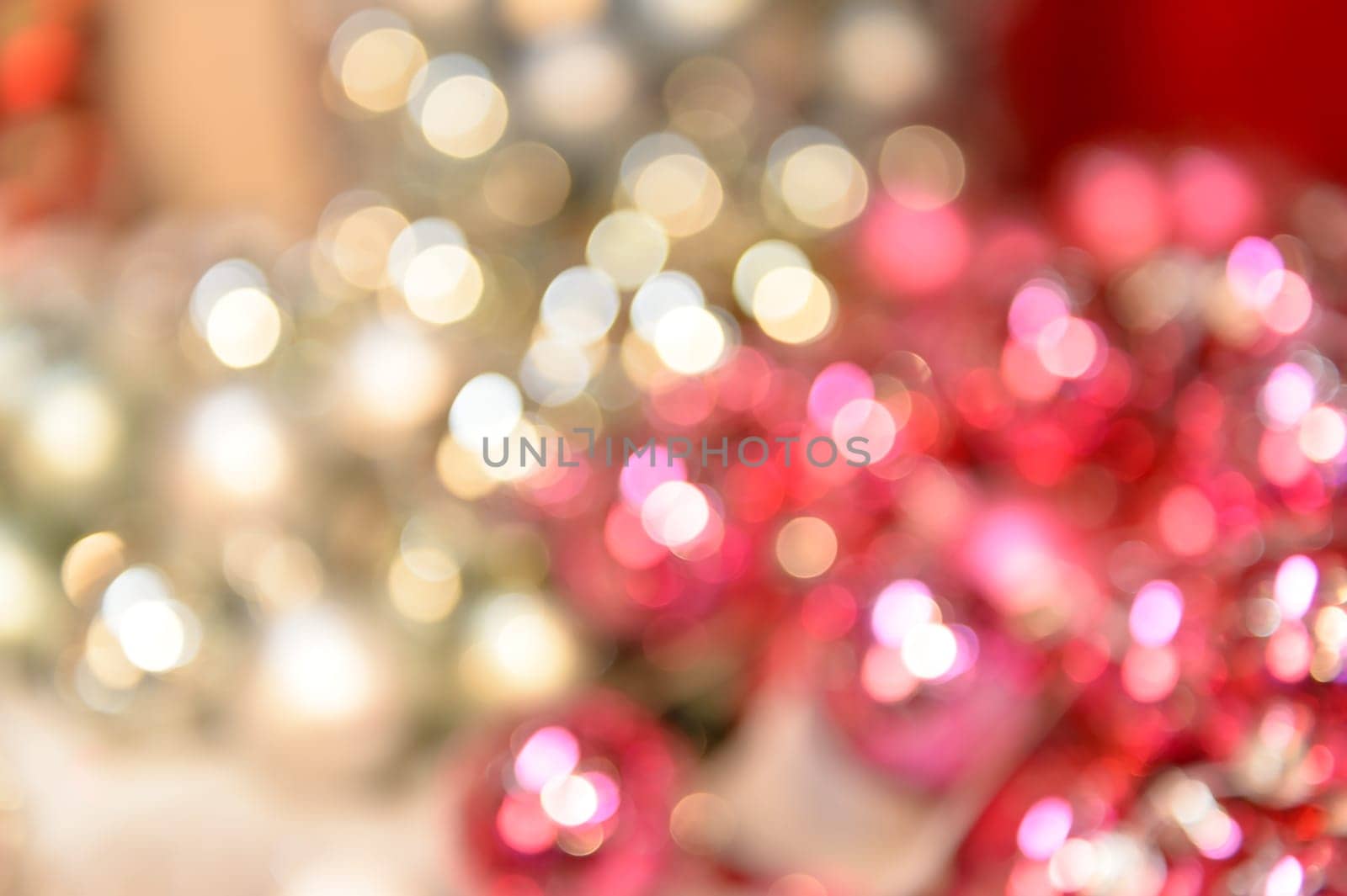 Blurred shiny silver and pink Christmas background balls