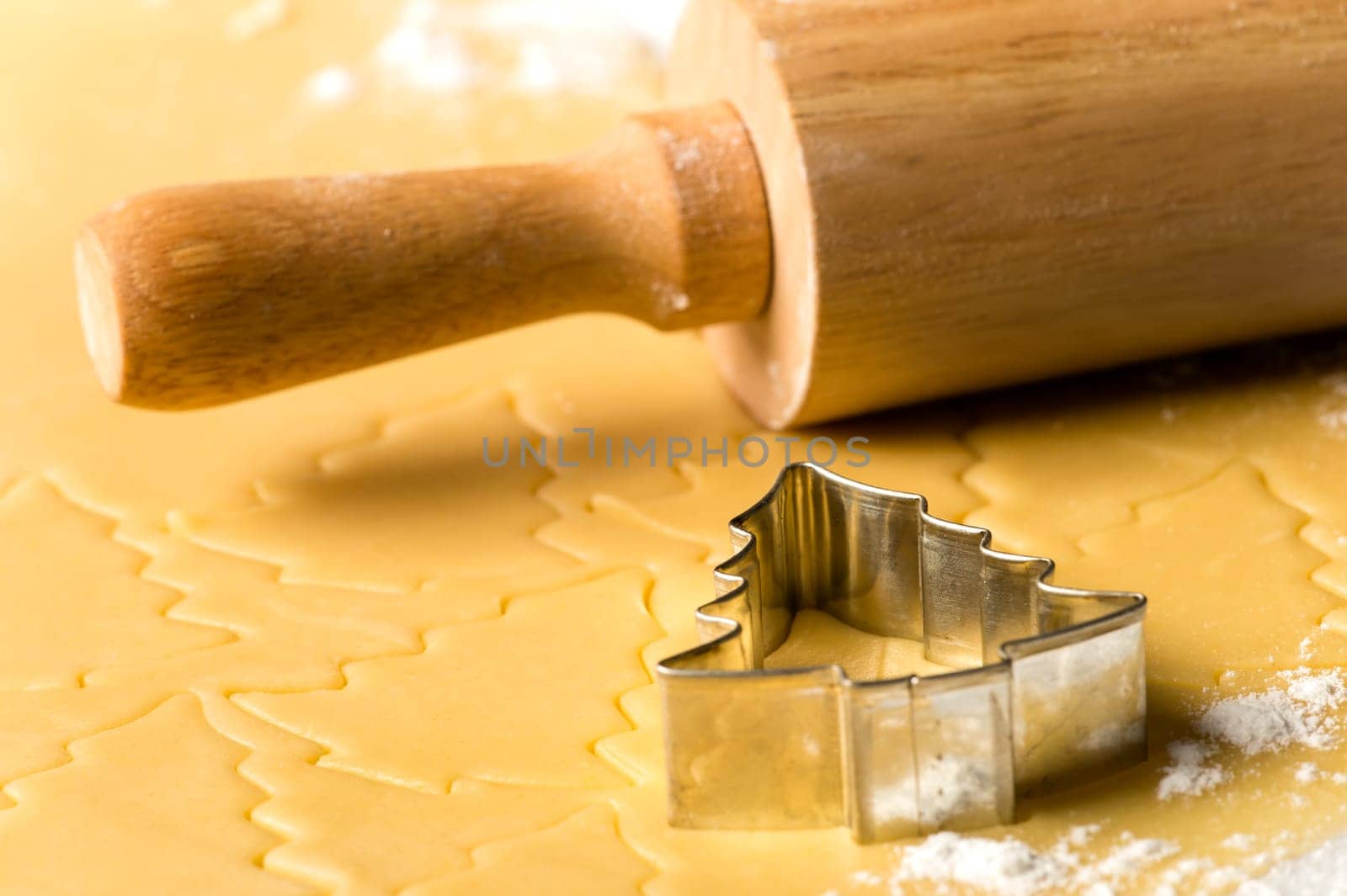 Christmas cookie dough baking sweets with rolling pin and cutter