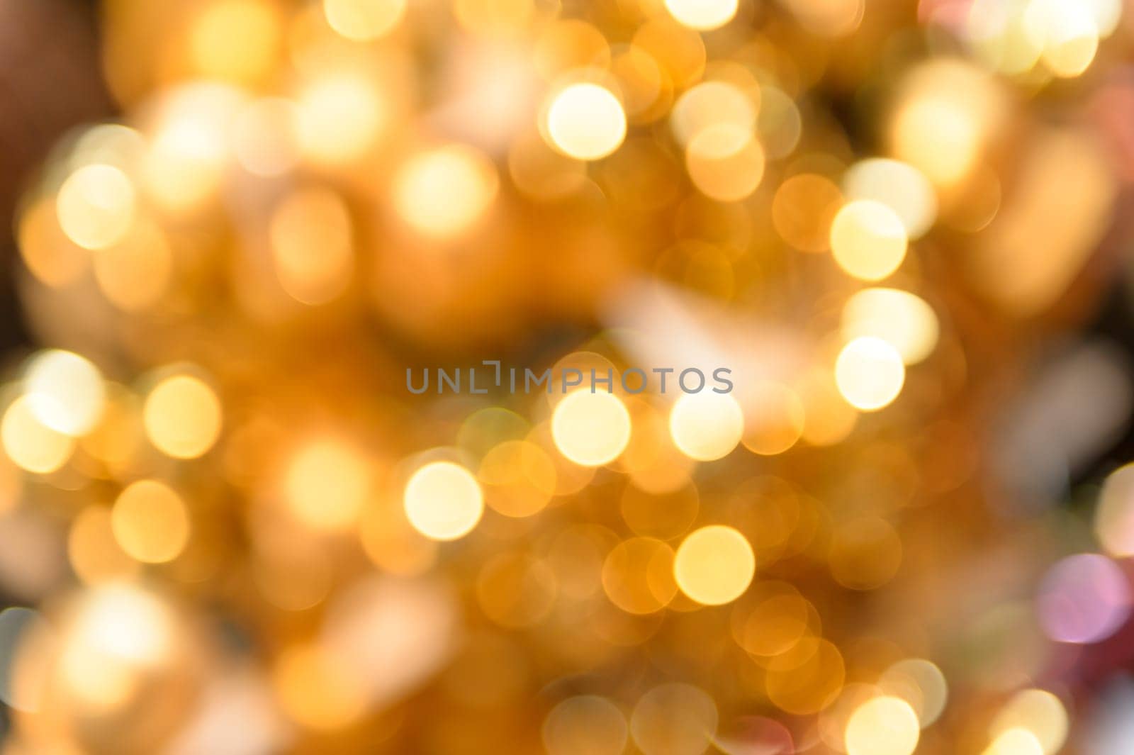 Glittering golden Christmas background blurred