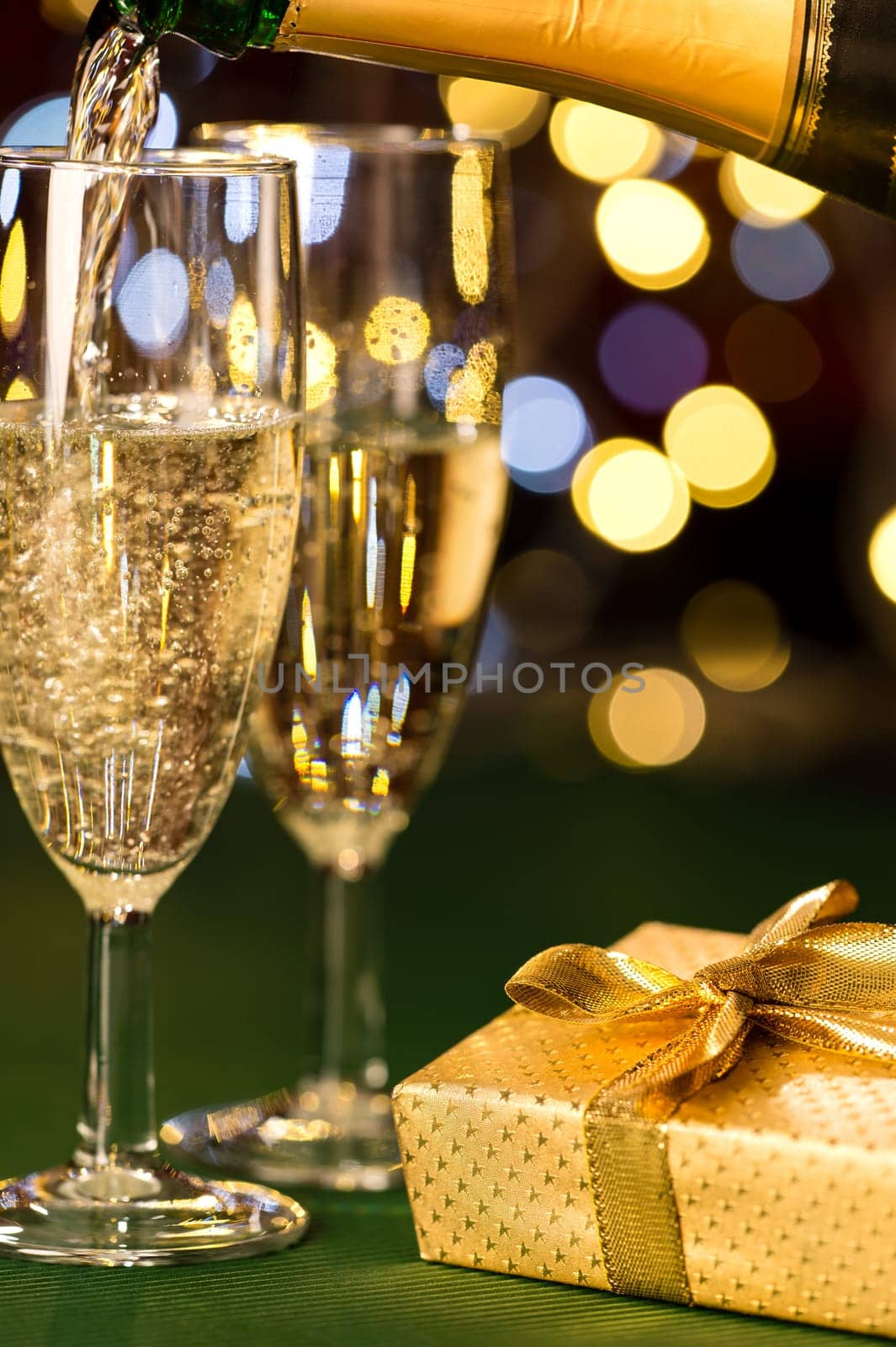Glasses of champagne and present for special occasion gold decoration