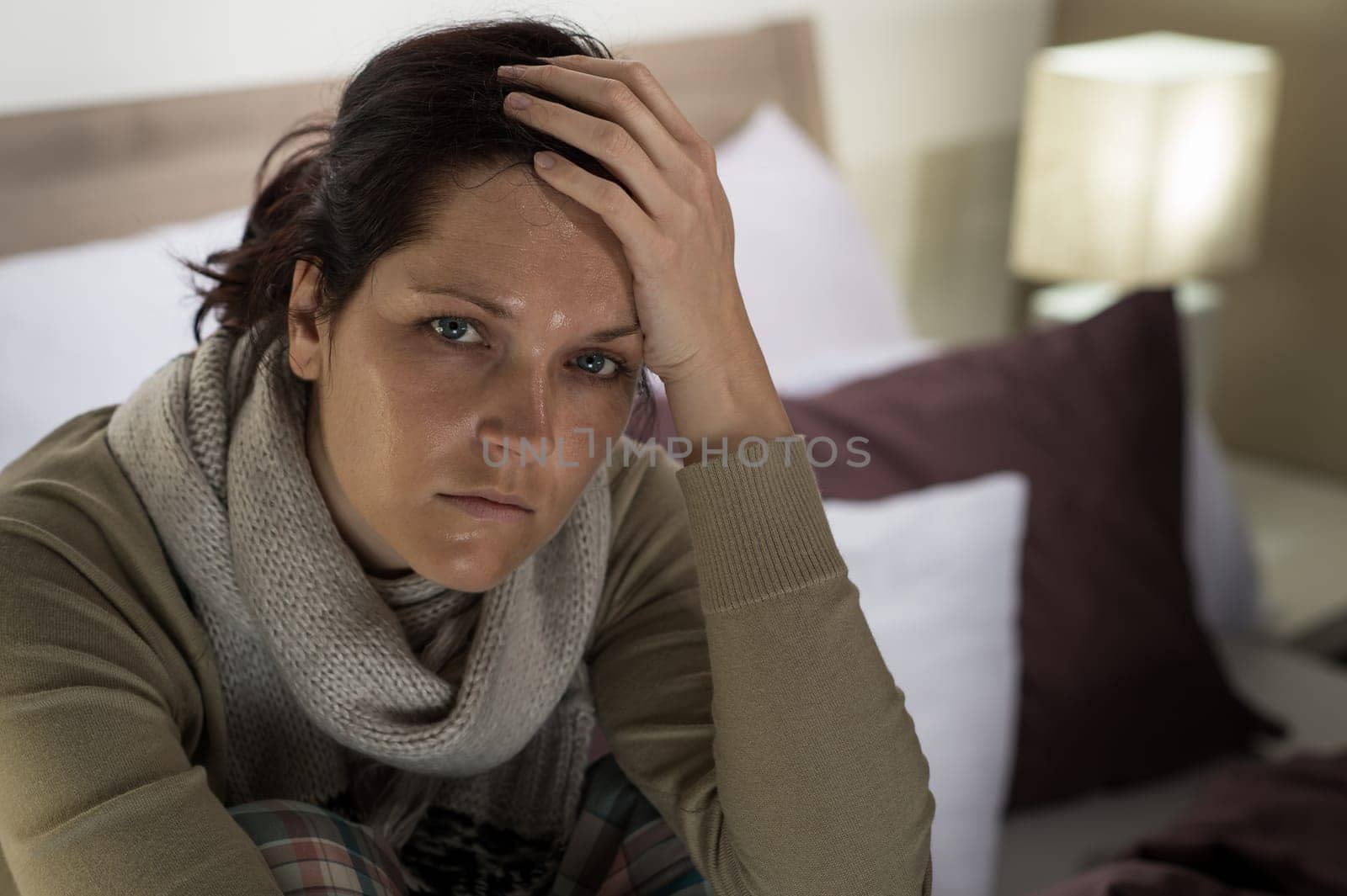 Portrait of woman suffering from fever and headache