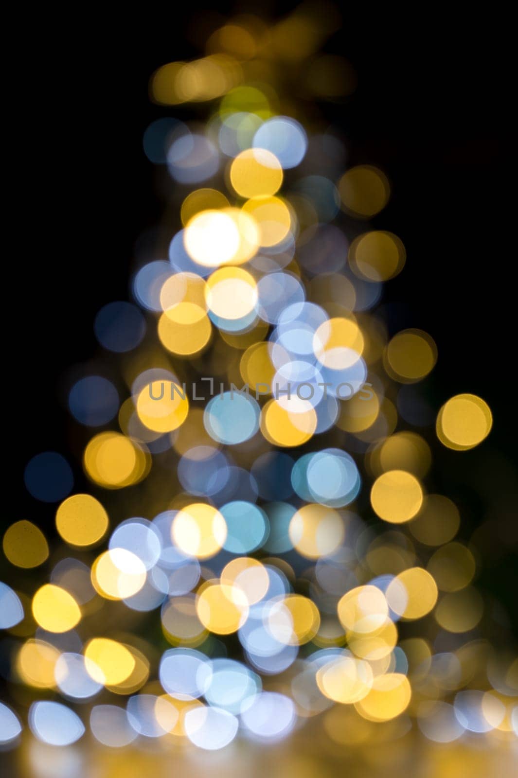 Golden and blue christmas lights illuminated Background tree