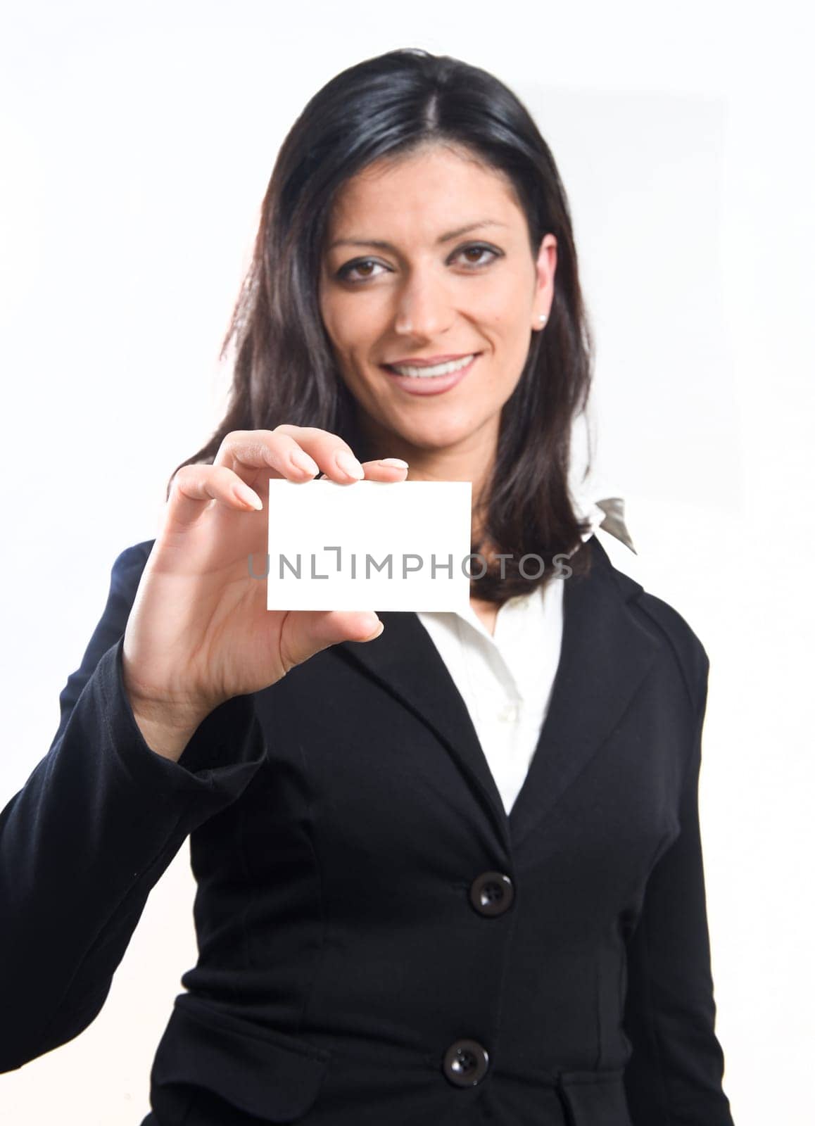 smiling businesswoman in black suit showing his business card