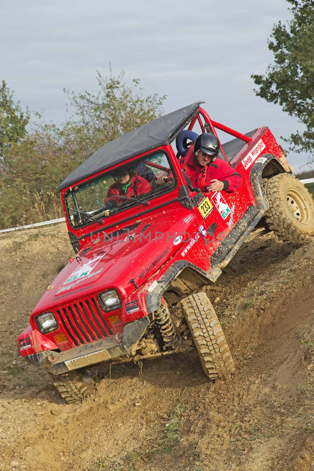 MOHELNICE, CZECH REPUBLIC - OCT 05. Red off-road car on a trial race in the "BIG SHOCK CUP Trial 2013"" on October 05, 2013 in Mohelnice, Czech Republic."