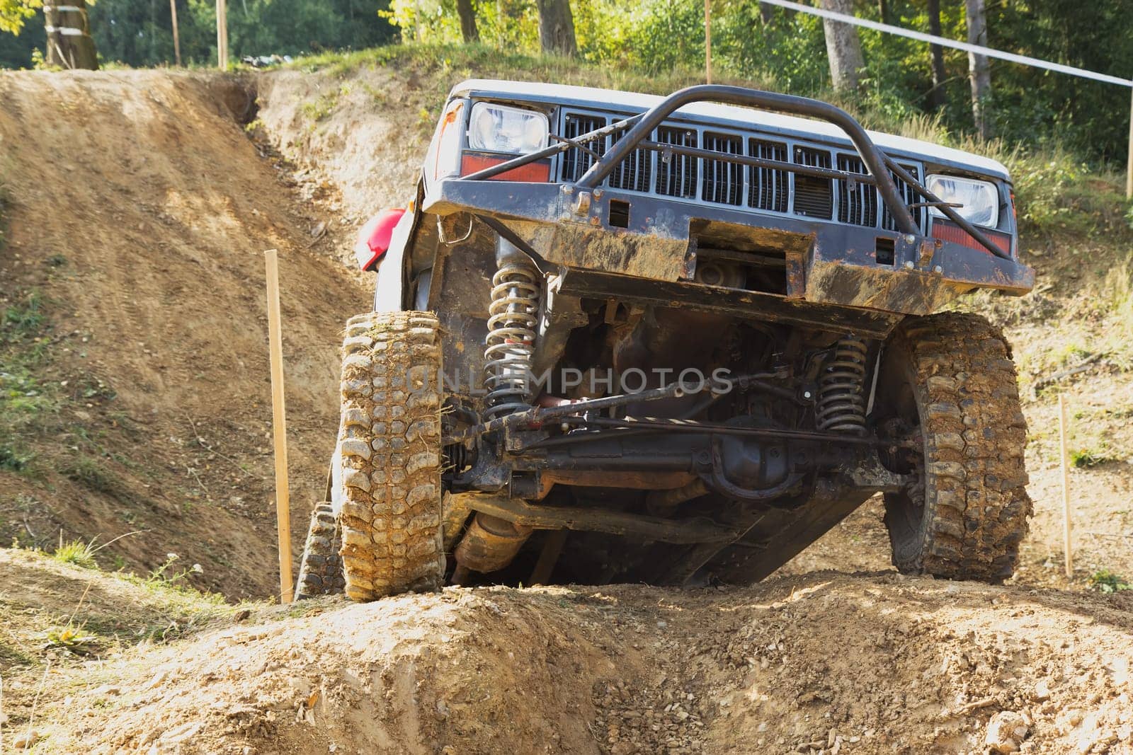 MOHELNICE, CZECH REPUBLIC - OCT 05. Off-road car in difficult terrain  on a trial race in the "BIG SHOCK CUP Trial 2013"" on October 05, 2013 in Mohelnice, Czech Republic."