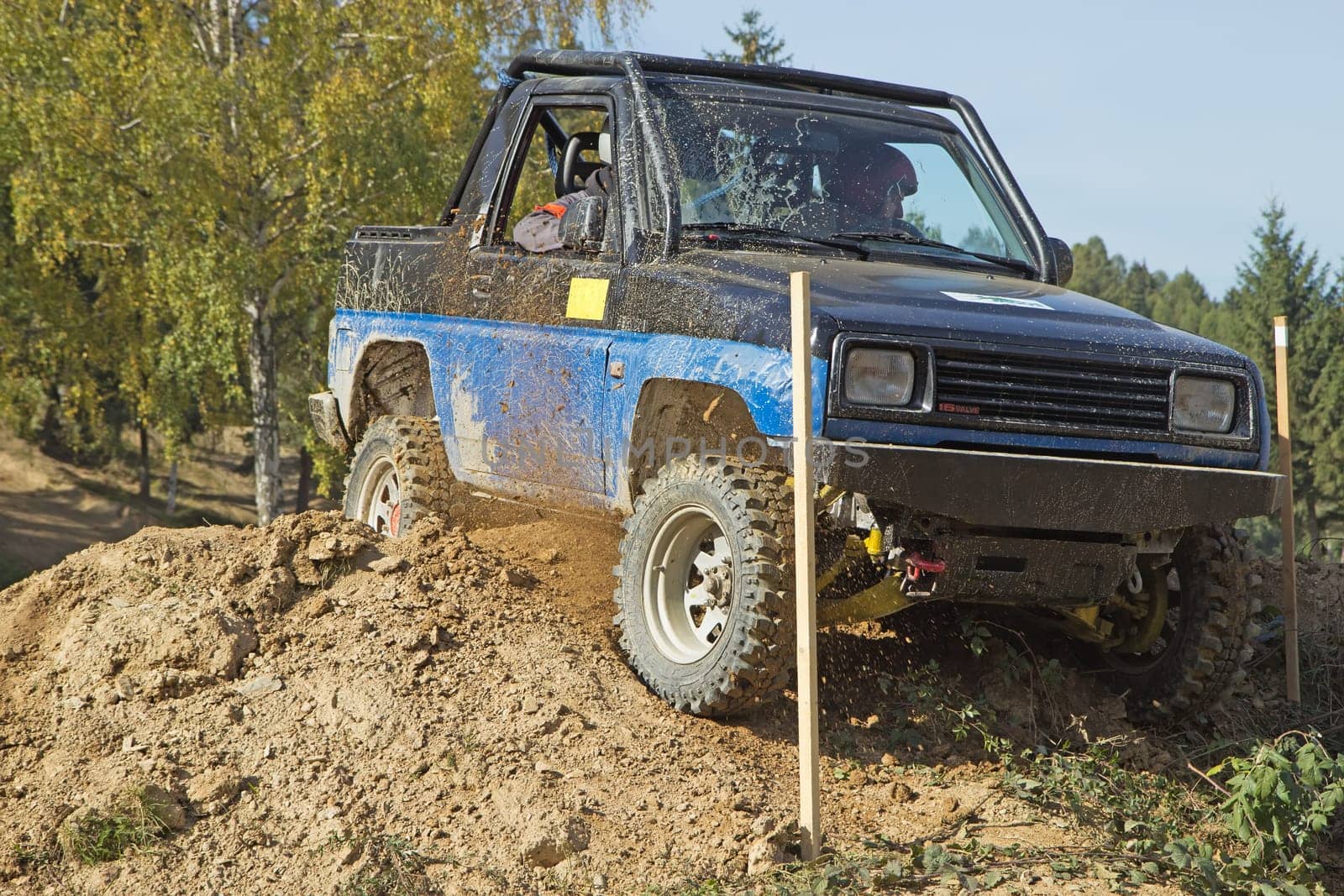MOHELNICE, CZECH REPUBLIC - OCT 05. Blue off-road car on a trial race in the "BIG SHOCK CUP Trial 2013"" on October 05, 2013 in Mohelnice, Czech Republic."