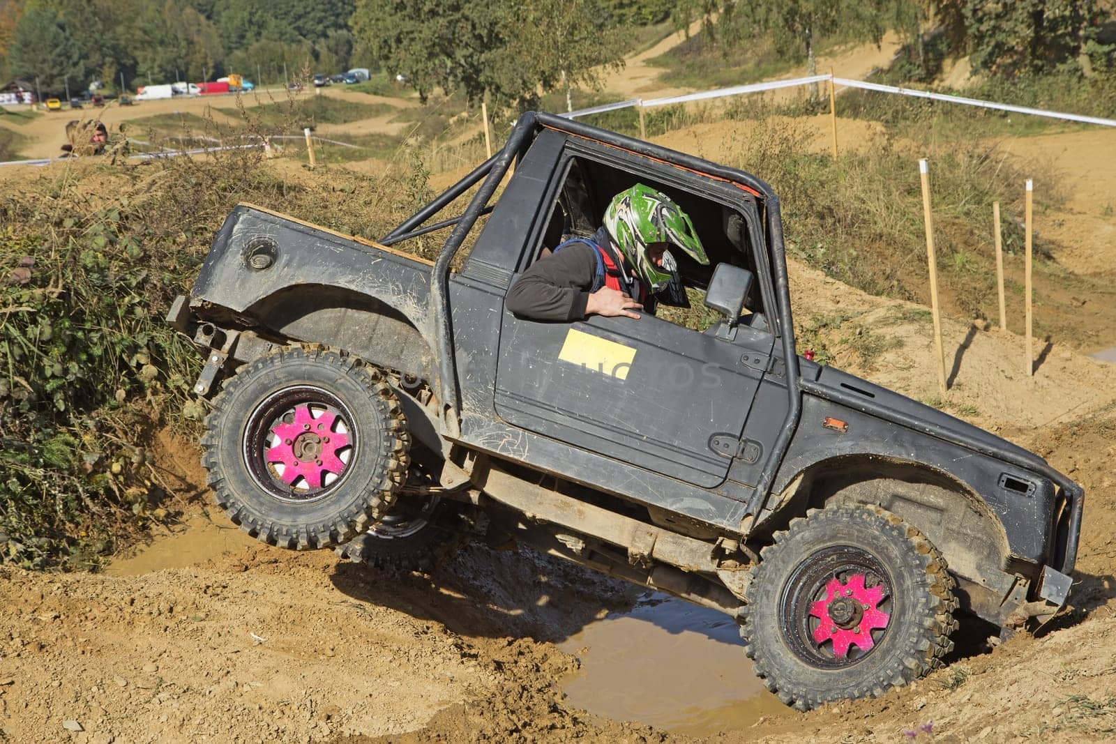 MOHELNICE, CZECH REPUBLIC - OCT 05. Off-road car is owercoming a terrain  on a trial race in the "BIG SHOCK CUP Trial 2013"" on October 05, 2013 in Mohelnice, Czech Republic."
