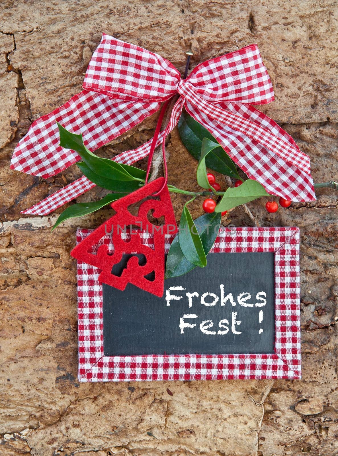 Rustic background with Christmas decorations and holly branches
