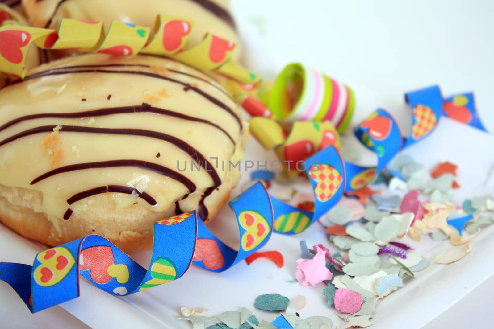 Berliners covered with icing and chocolate