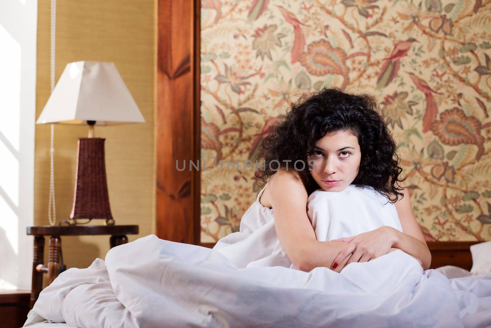 Woman enjoy lounging in bed after restless night