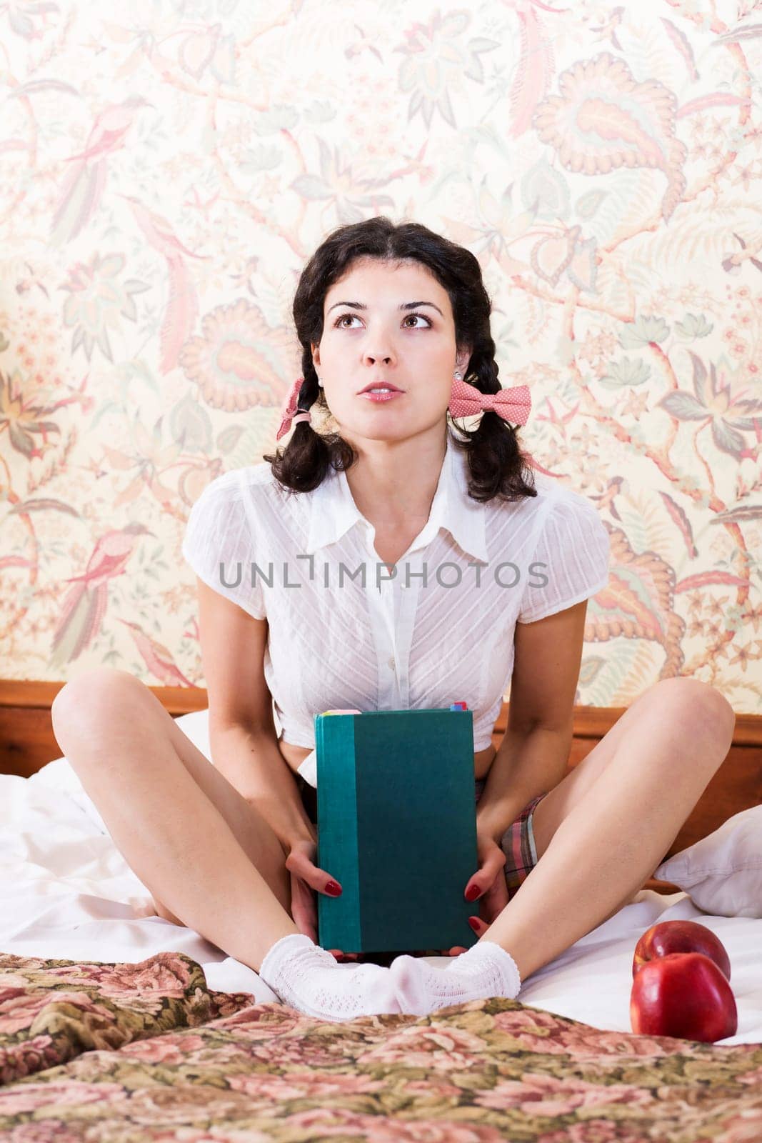 Woman in schoolgirl dress hold book and dream