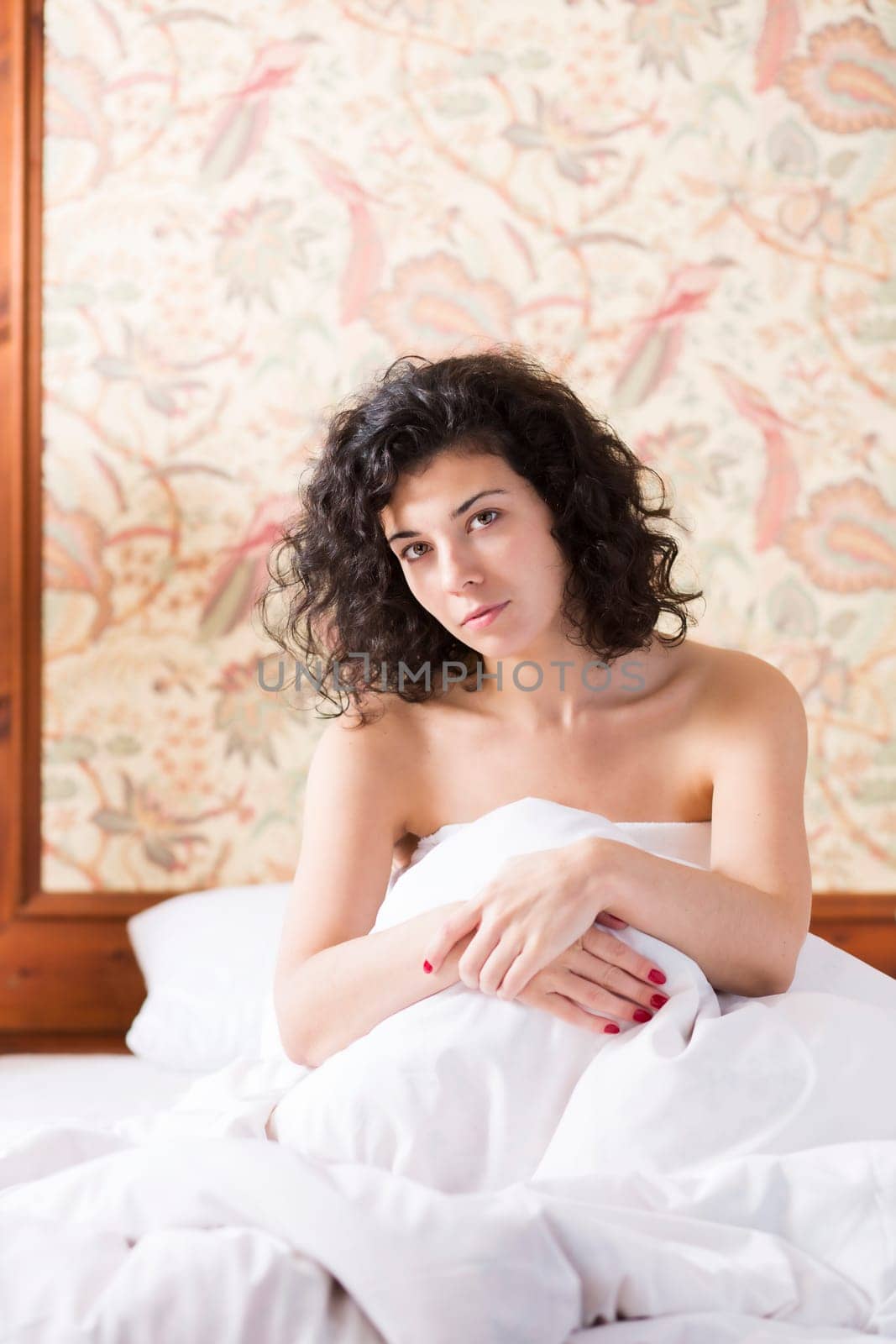 Pretty woman cross arms before herself while sitting