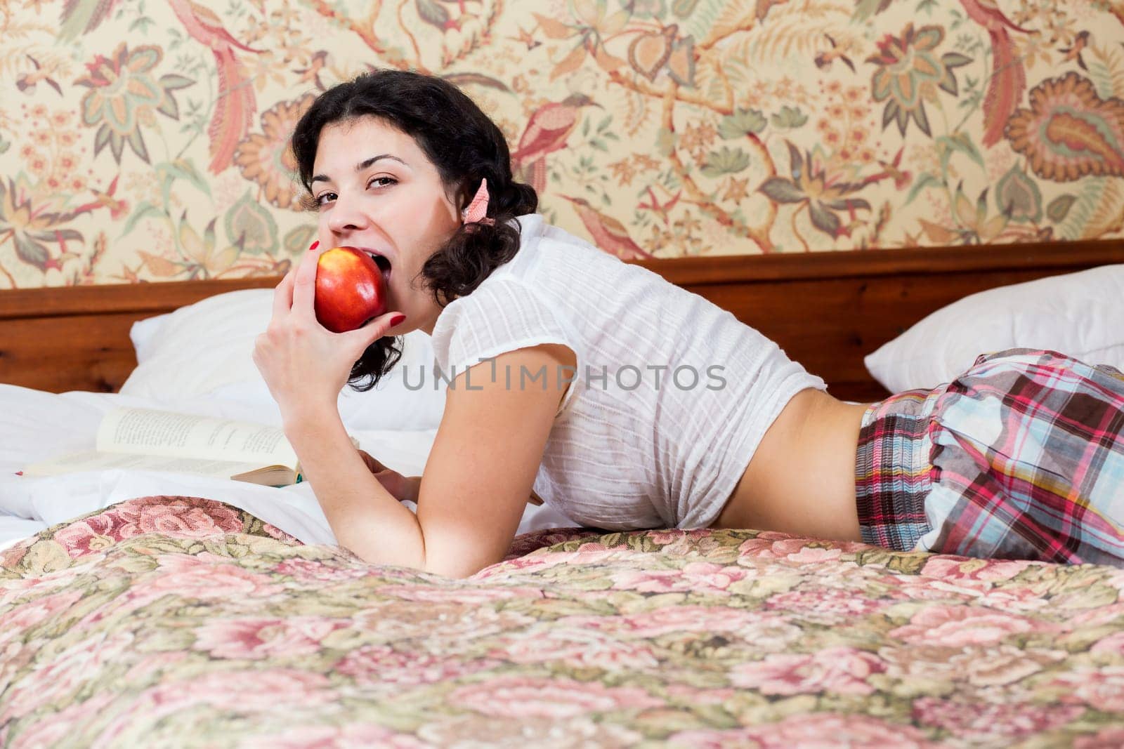 Woman in schoolgirl dress tired of eating apples