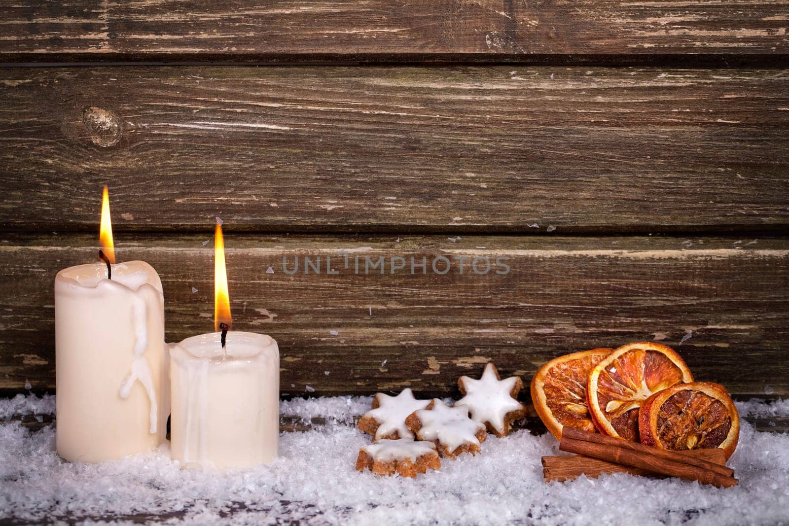 Candles,cinnamon stars and oranges