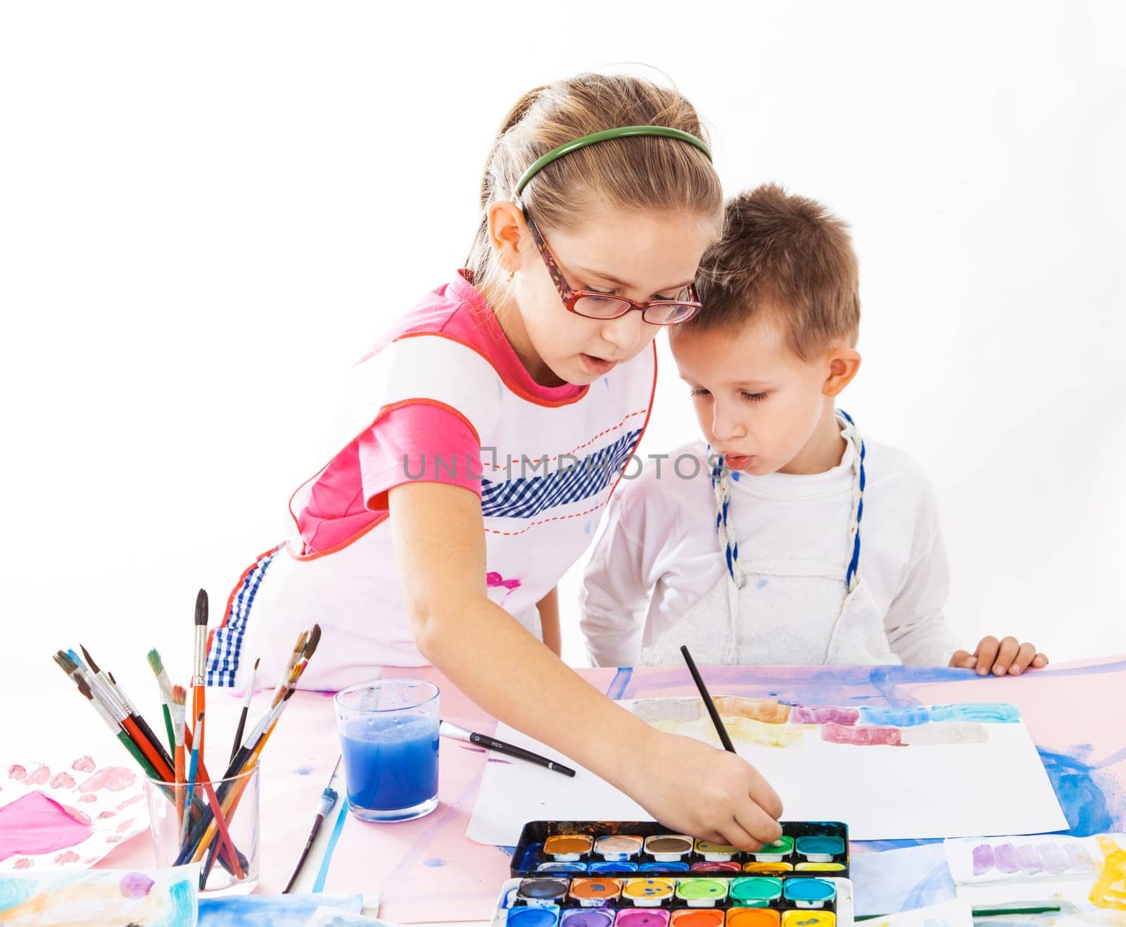 Casual kids painting with watercolor